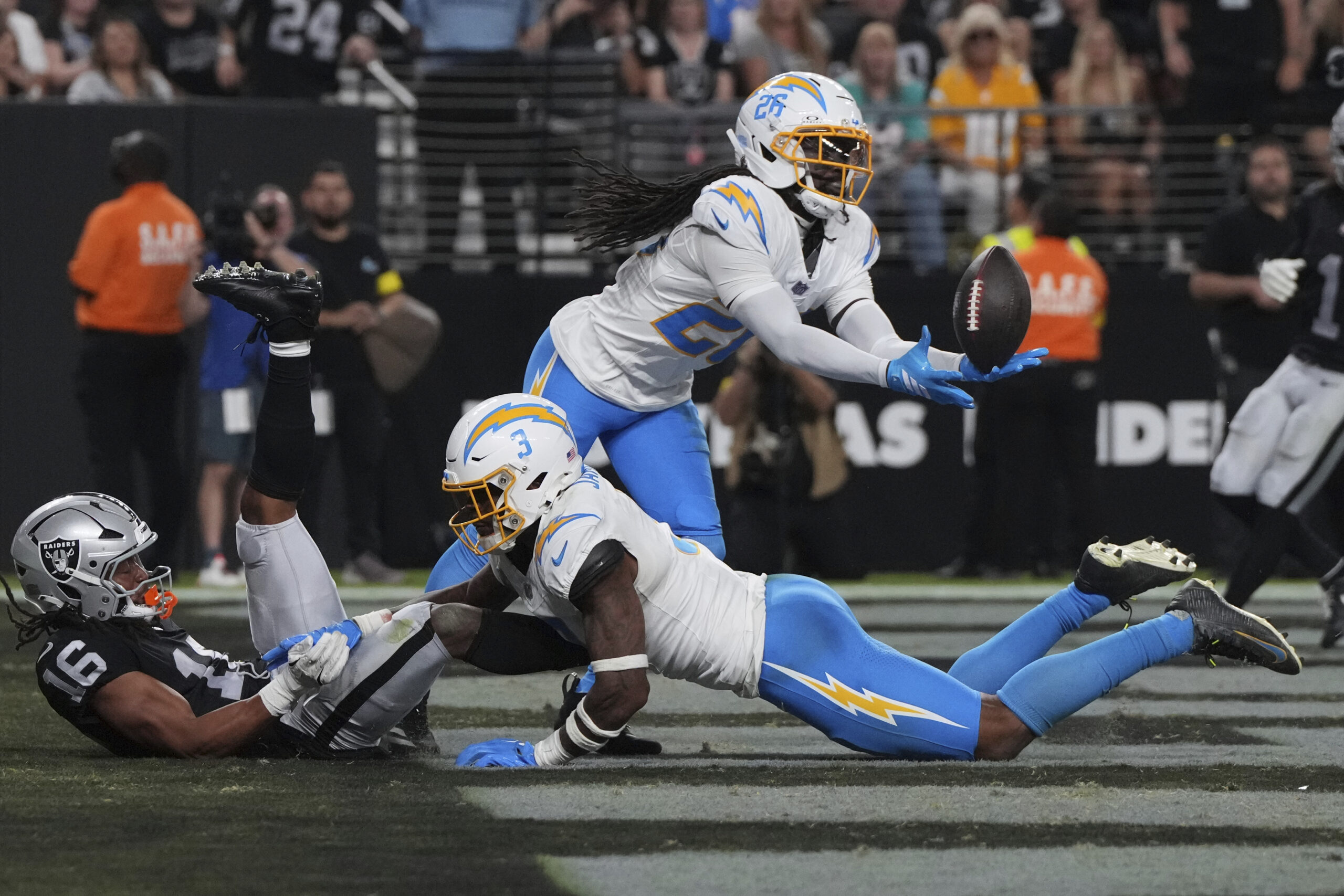 Chargers cornerback Donte Jackson (26) intercepts a pass intended for...