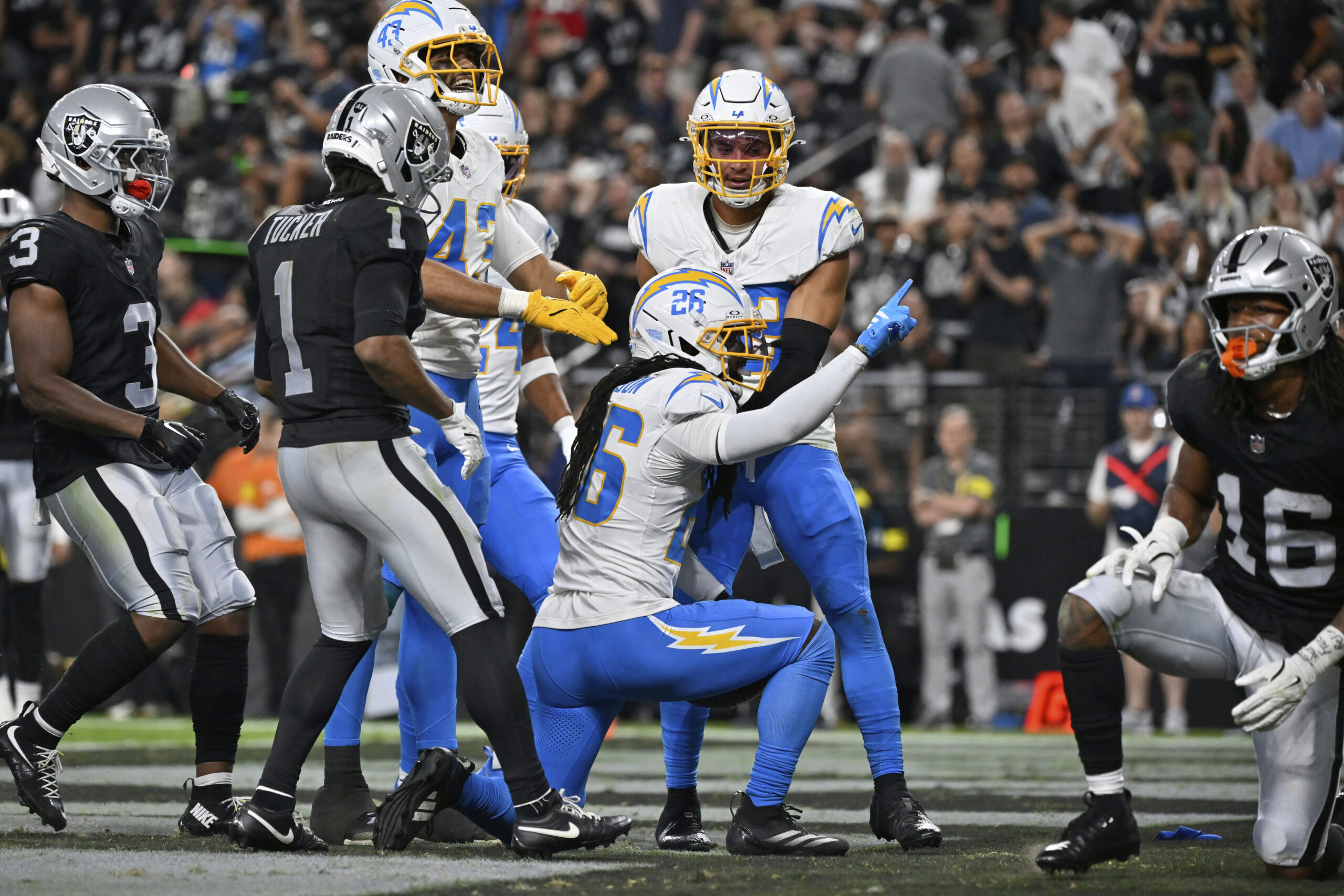 Chargers cornerback Donte Jackson (26) celebrates after making an interception...