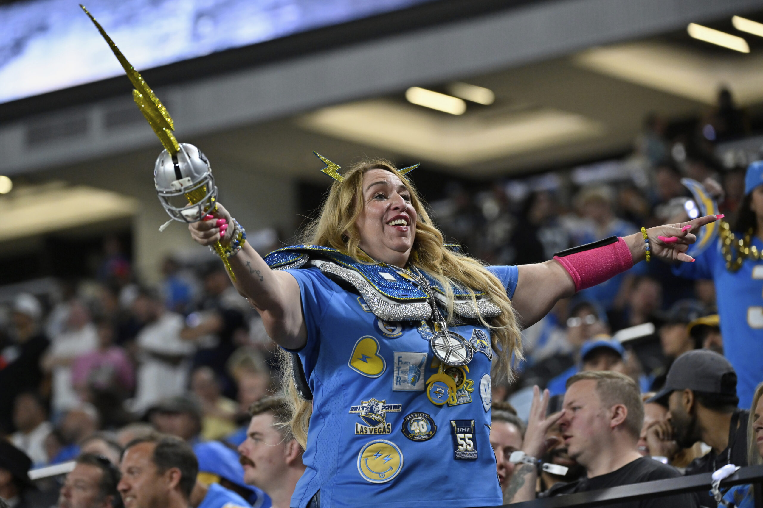 A Chargers fan cheers during the second half of a...