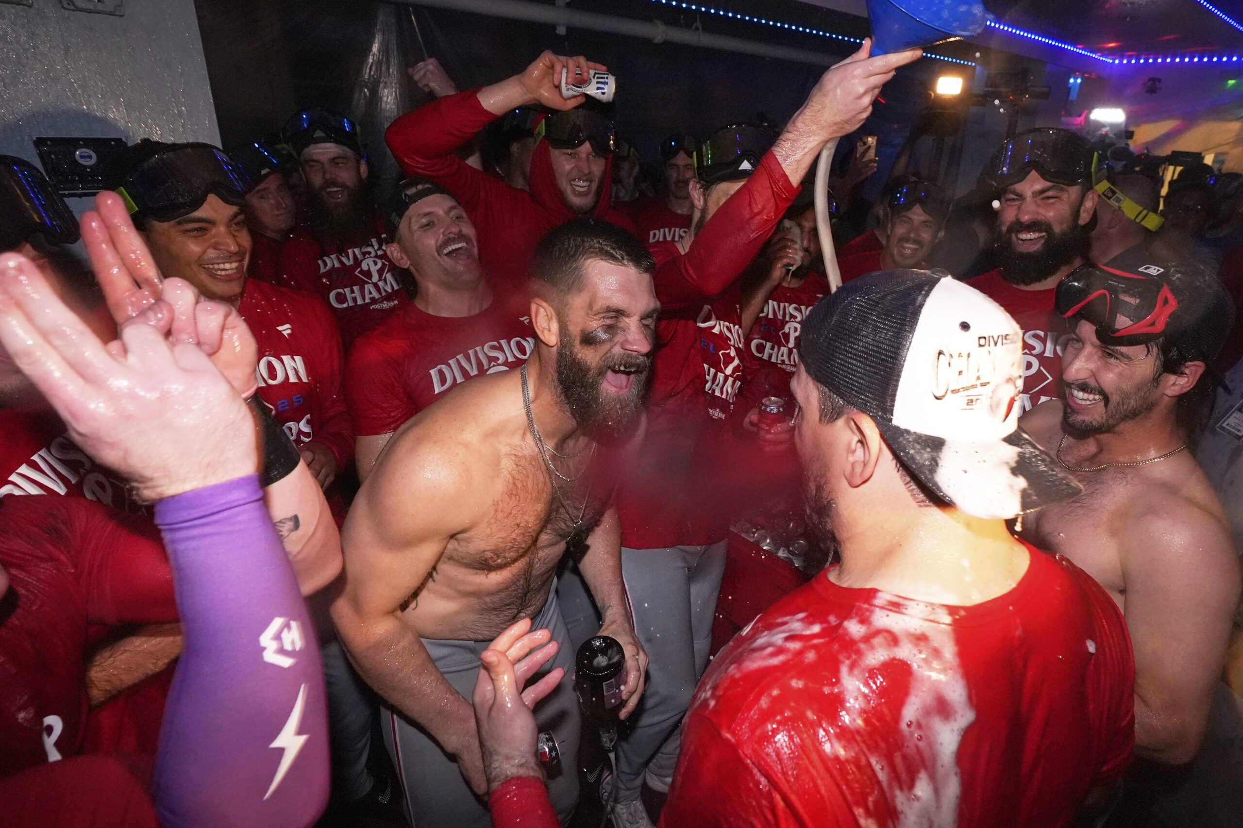 Philadelphia Phillies first baseman Bryce Harper, center, and teammates celebrate...