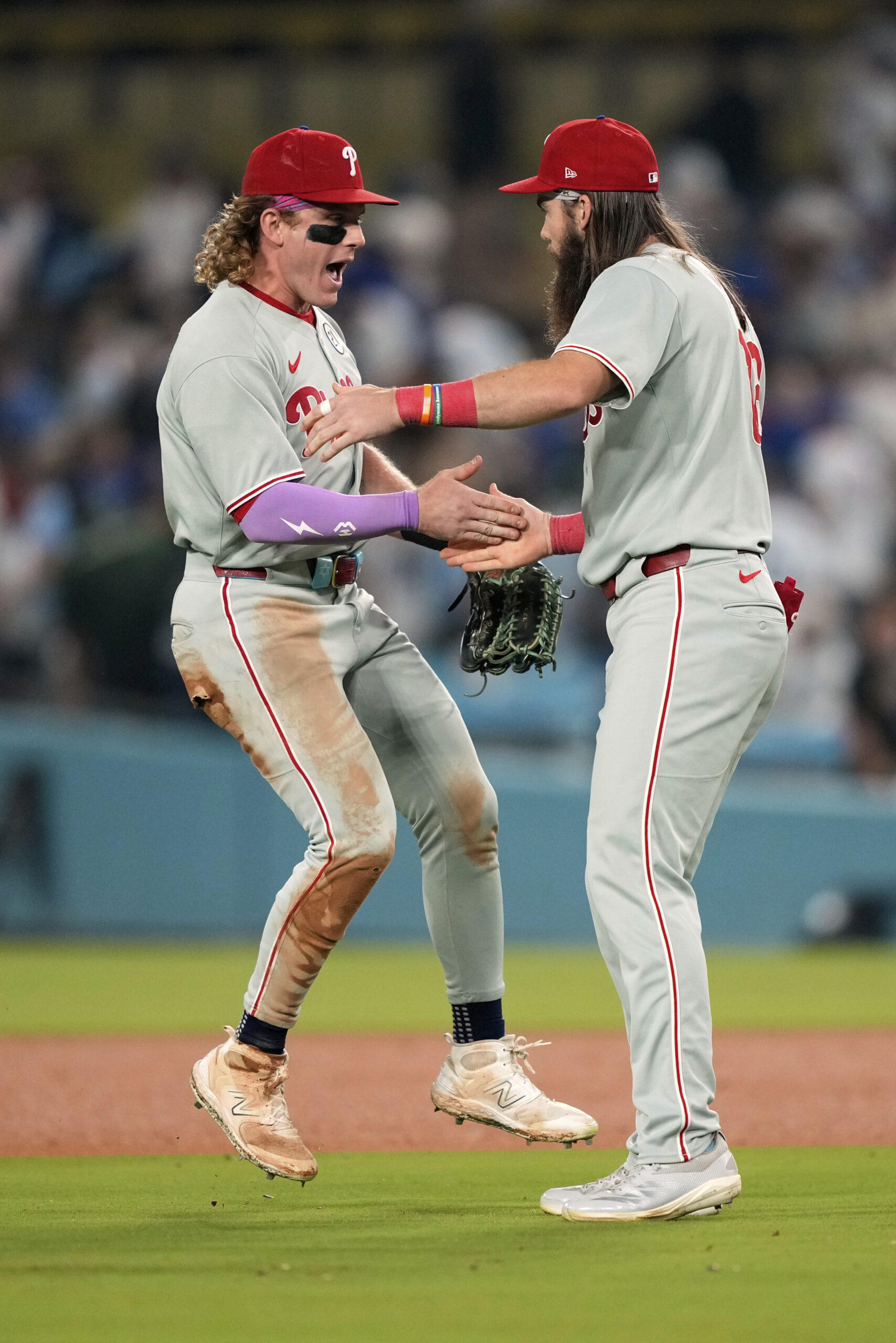 Philadelphia Phillies outfielders Harrison Bader, left, and Brandon Marsh celebrate...