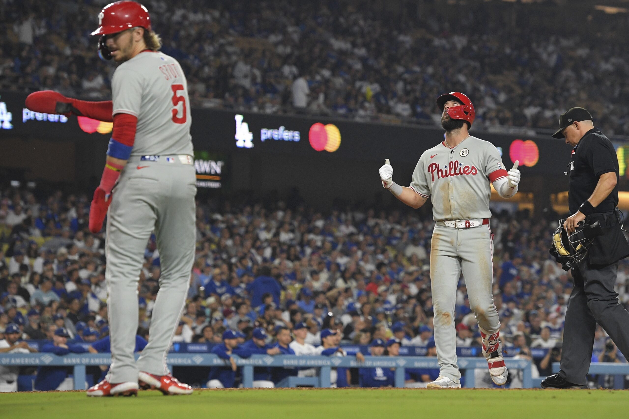 The Philadelphia Phillies’ Weston Wilson, right, celebrates after hitting a...