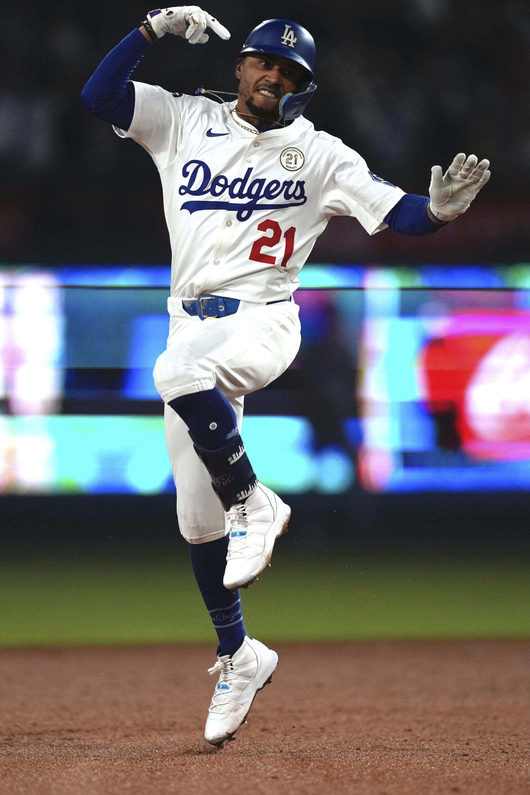 The Dodgers’ Mookie Betts celebrates as he runs the bases...