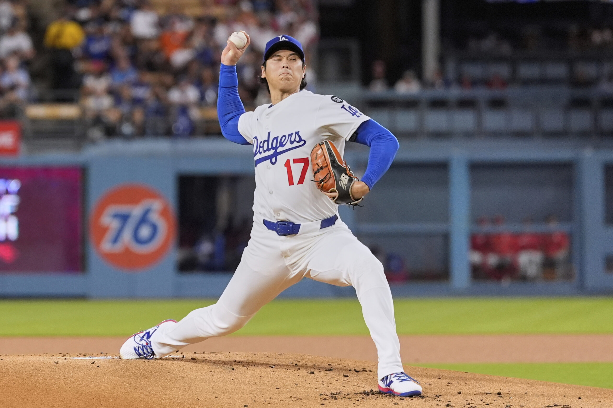 Dodgers starting pitcher Shohei Ohtani throws to the plate during...