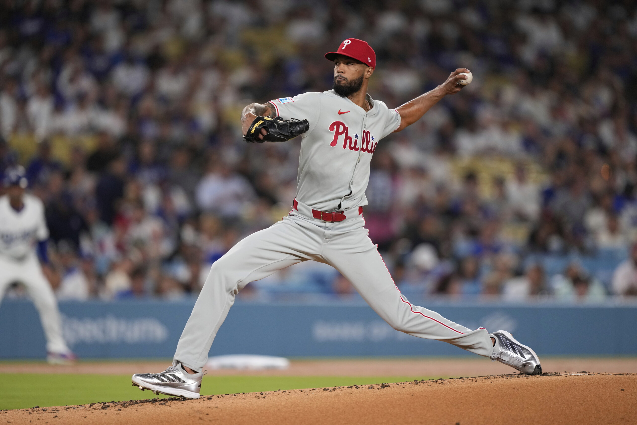 Philadelphia Phillies starting pitcher Cristopher Sanchez works against a Los...