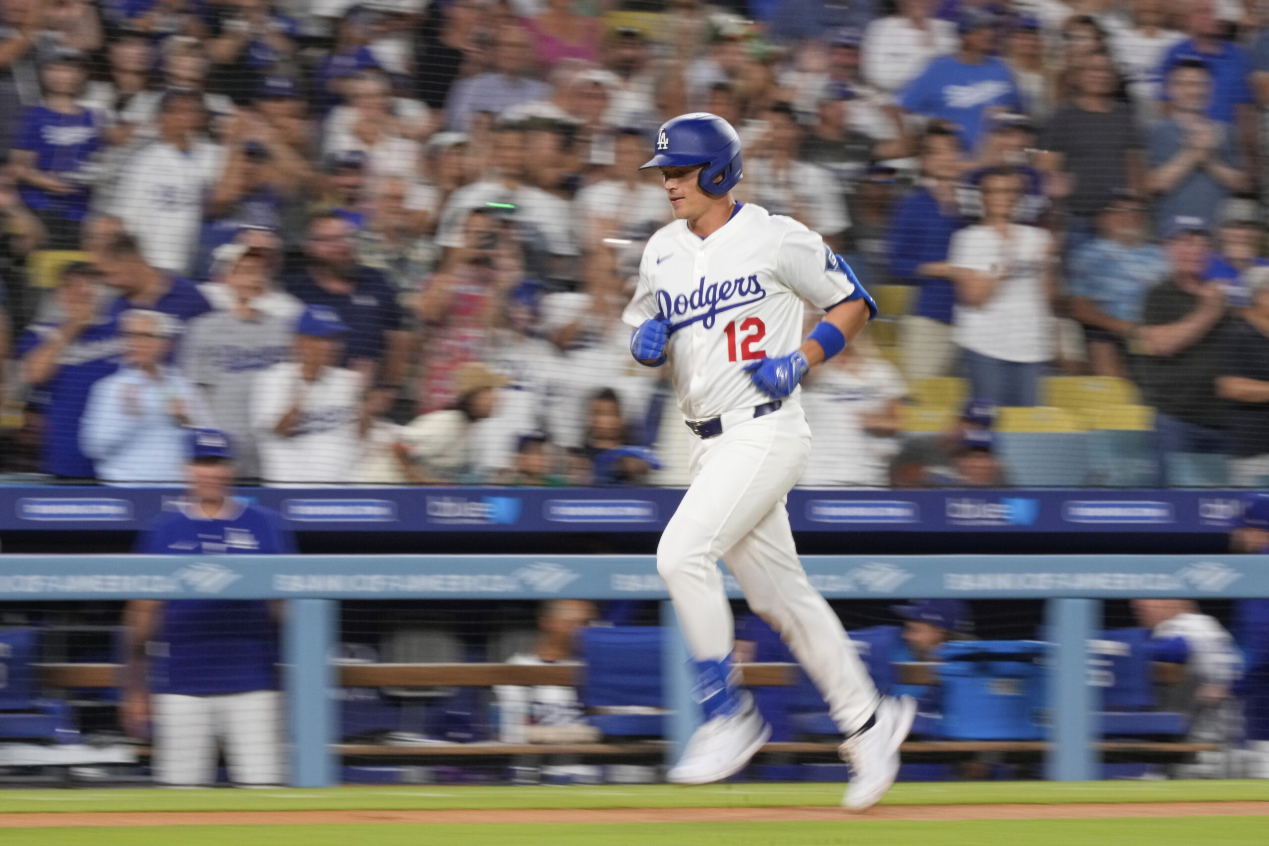 The Dodgers’ Alex Call rounds the bases after hitting a...