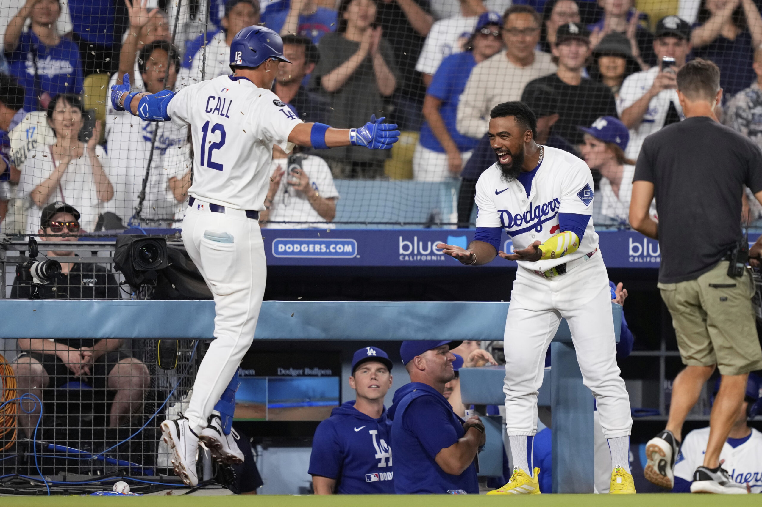 The Dodgers’ Alex Call, left, celebrates with teammate Teoscar Hernandez...