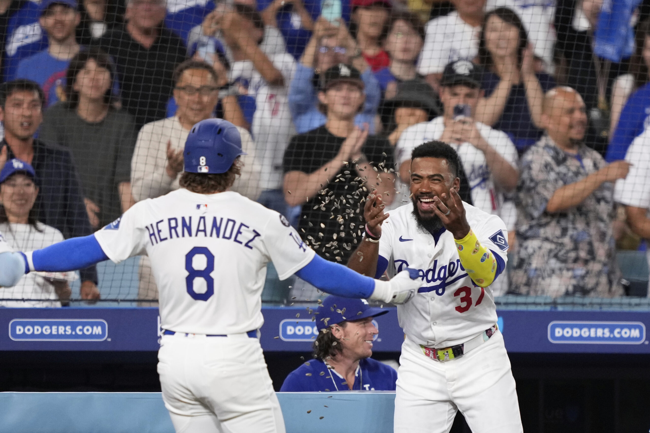 The Dodgers’ Kiké Hernandez (8) celebrates with teammate Teoscar Hernandez...