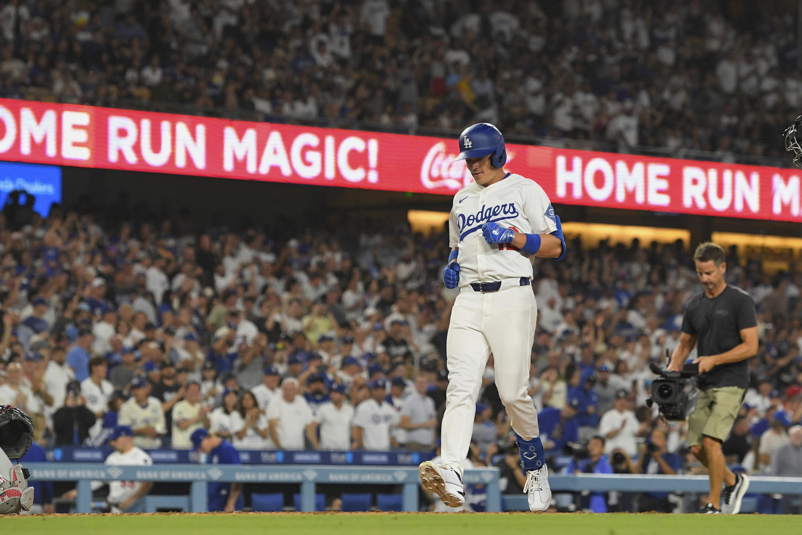 The Dodgers’ Alex Call rounds the bases after hitting a...
