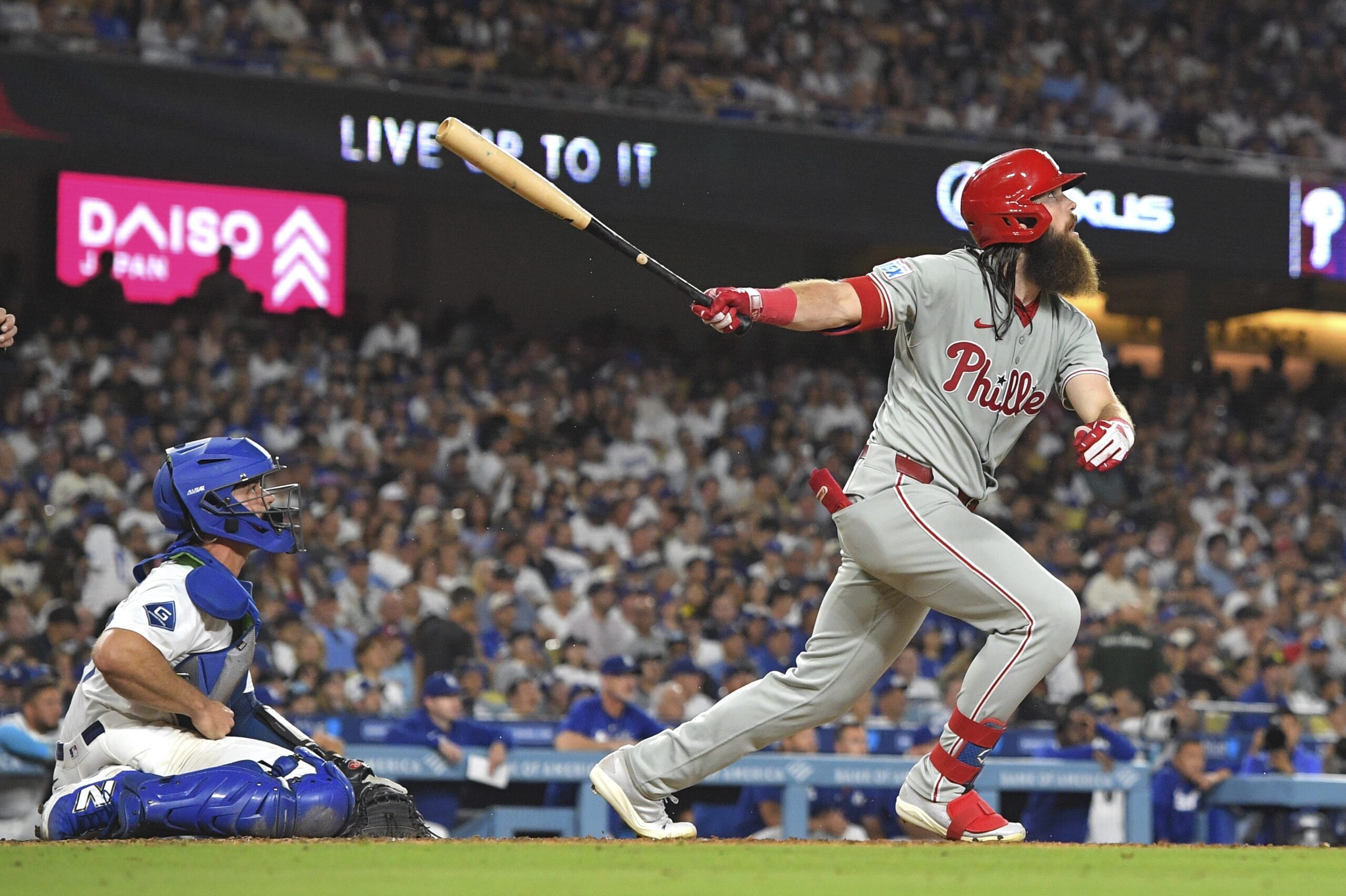 The Philadelphia Phillies’ Brandon Marsh, right, hits a three-run home...