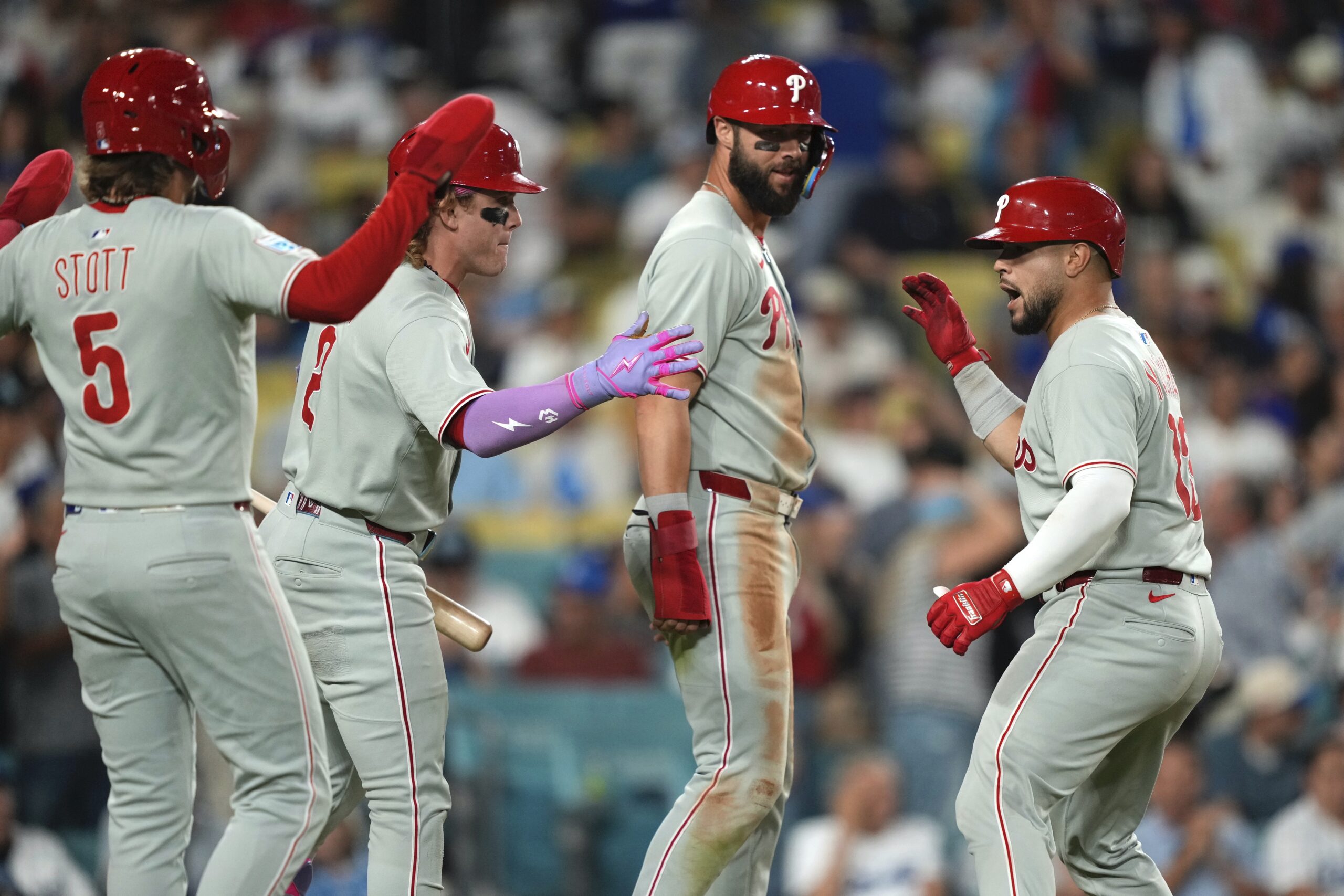 The Philadelphia Phillies’ Rafael Marchan, right, celebrates with, Bryson Stott,...