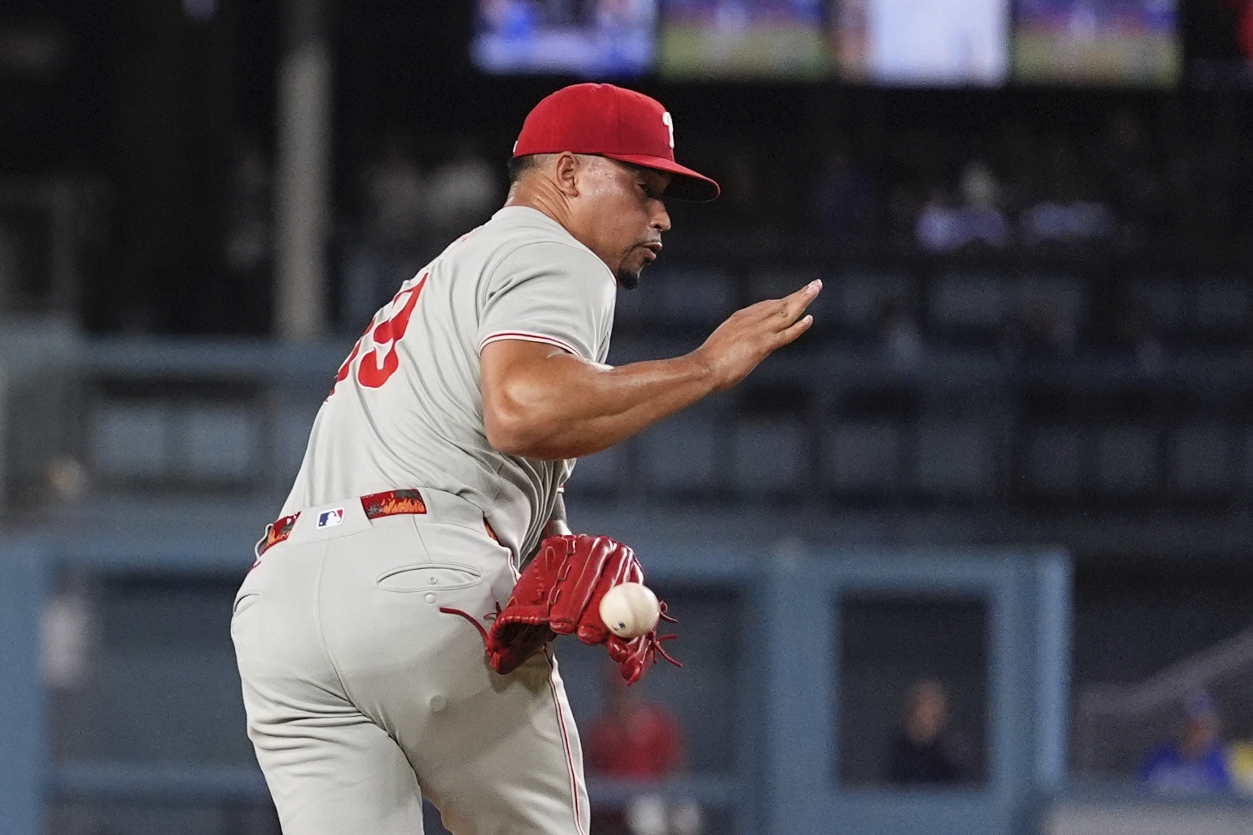 Philadelphia Phillies relief pitcher Jhoan Duran deflects a ball hit...