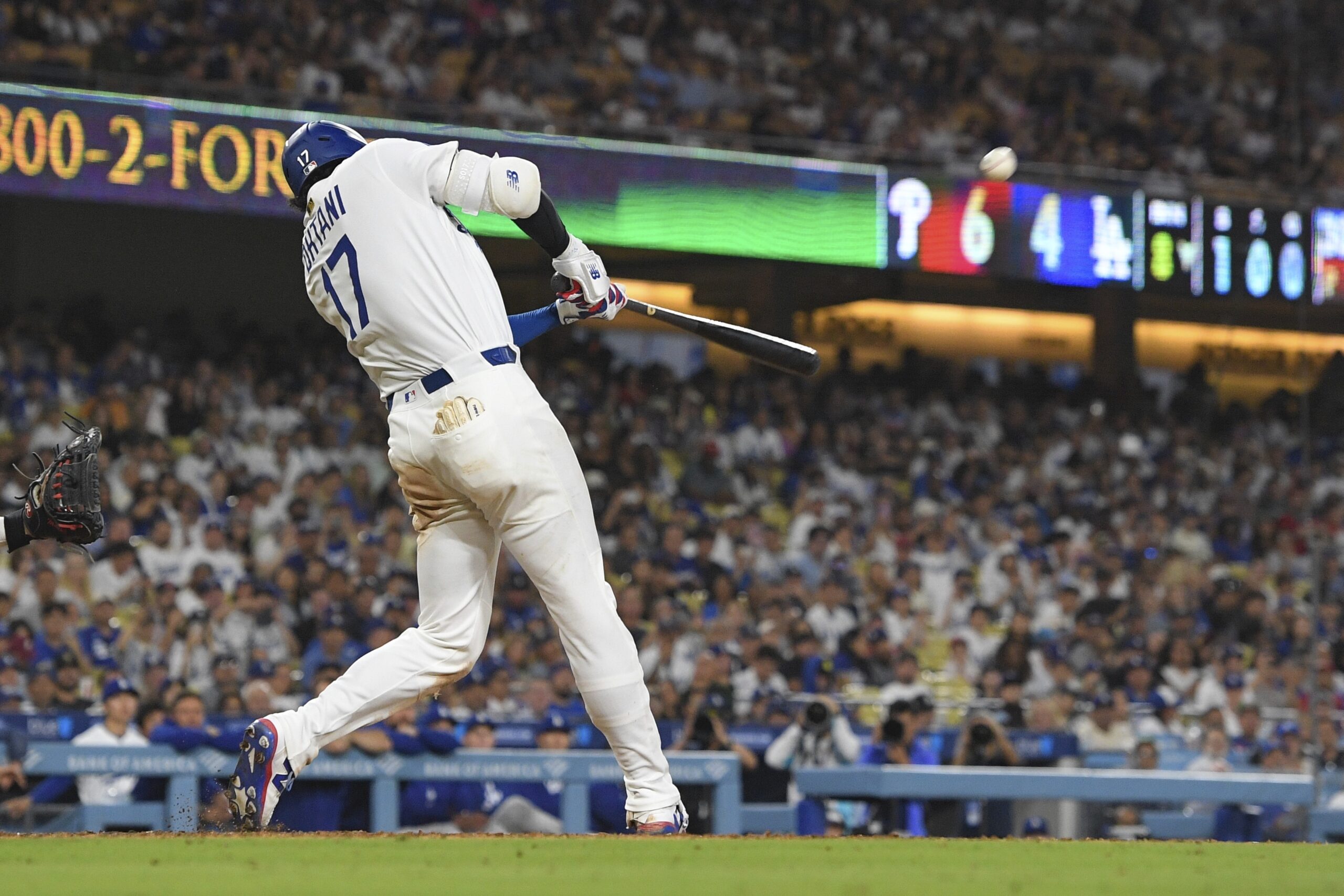 Dodgers star Shohei Ohtani hits a solo home run during...