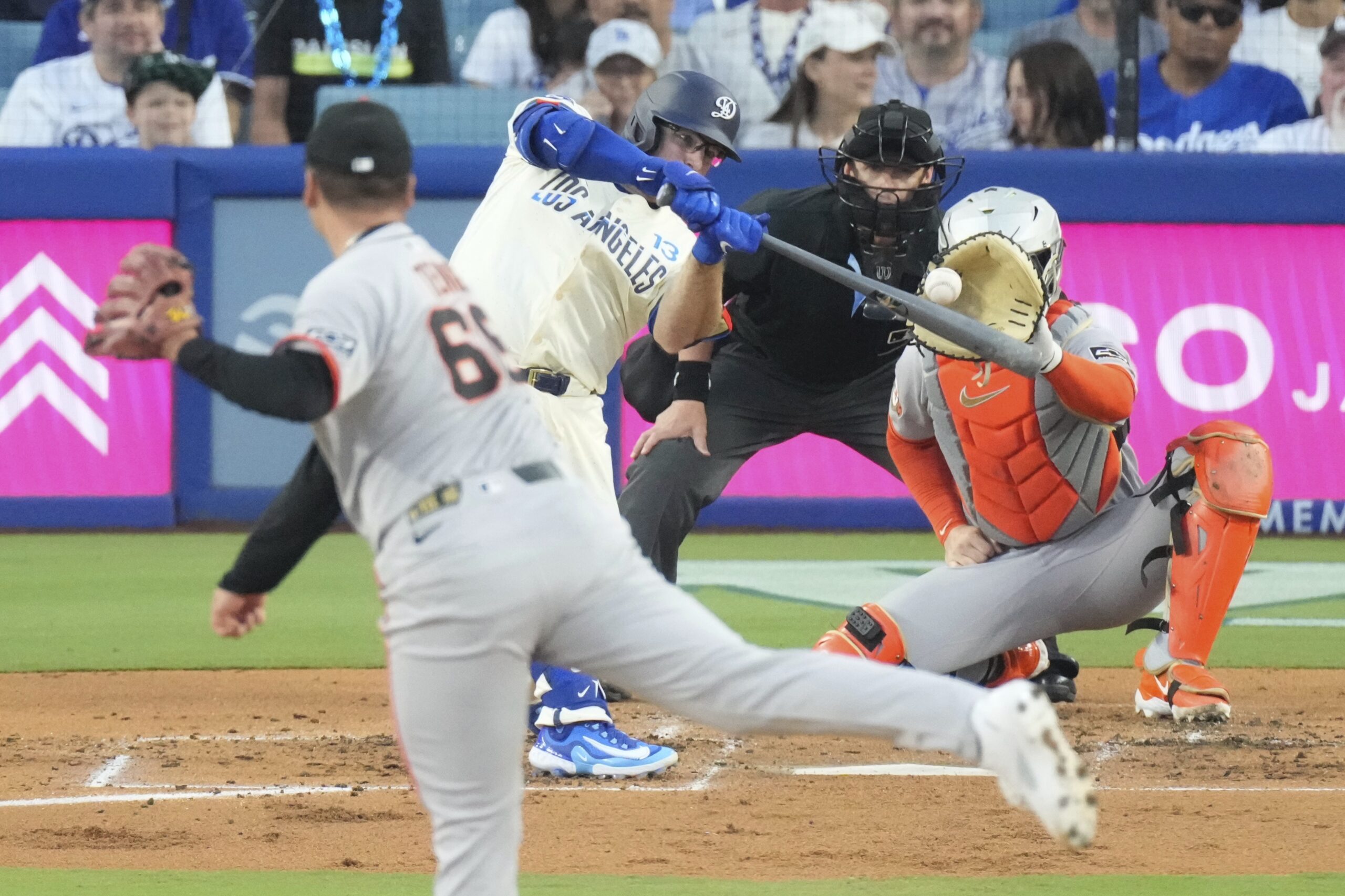 Dodgers’ Max Muncy , center, hits a two-run home run...