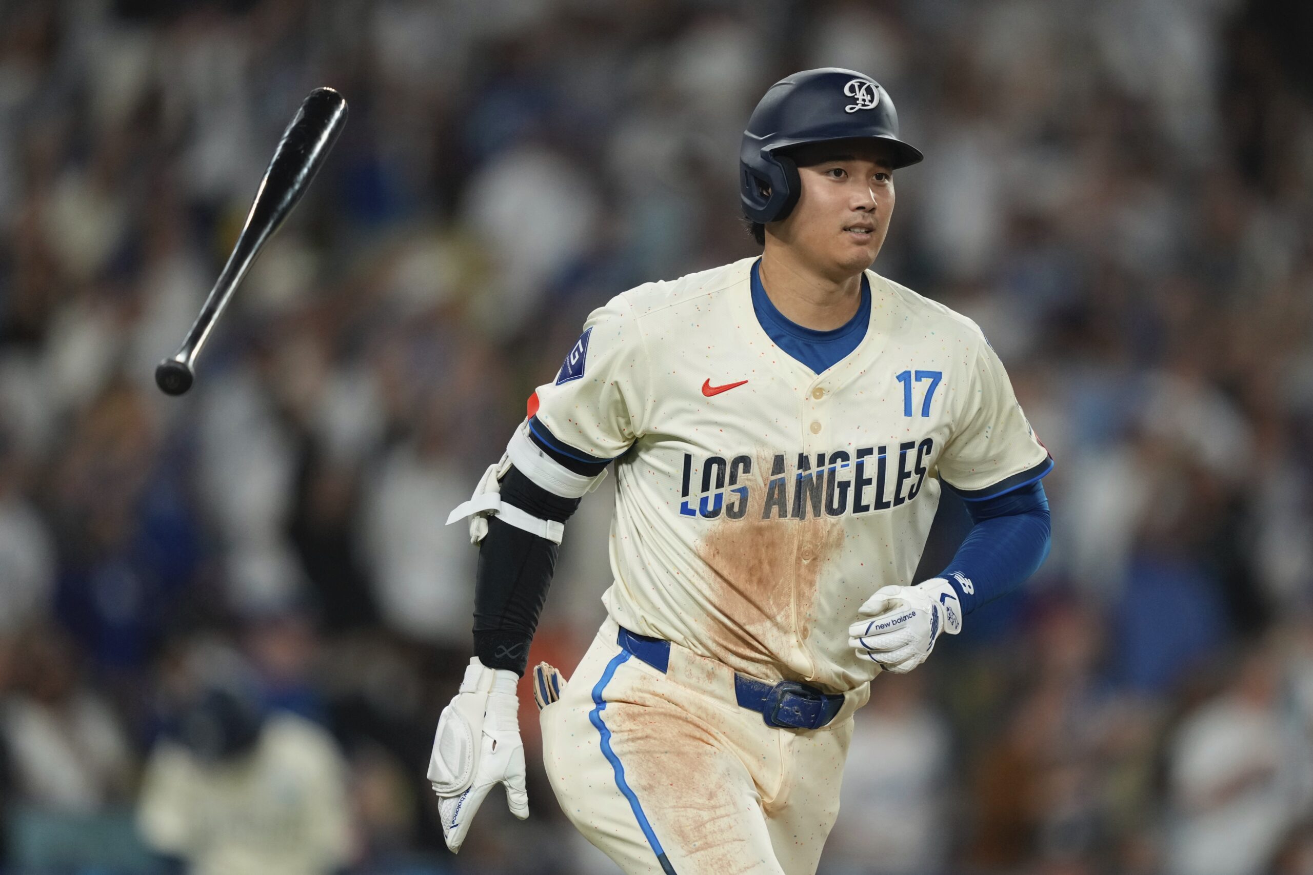 Dodgers’ Shohei Ohtani heads to first for a solo home...