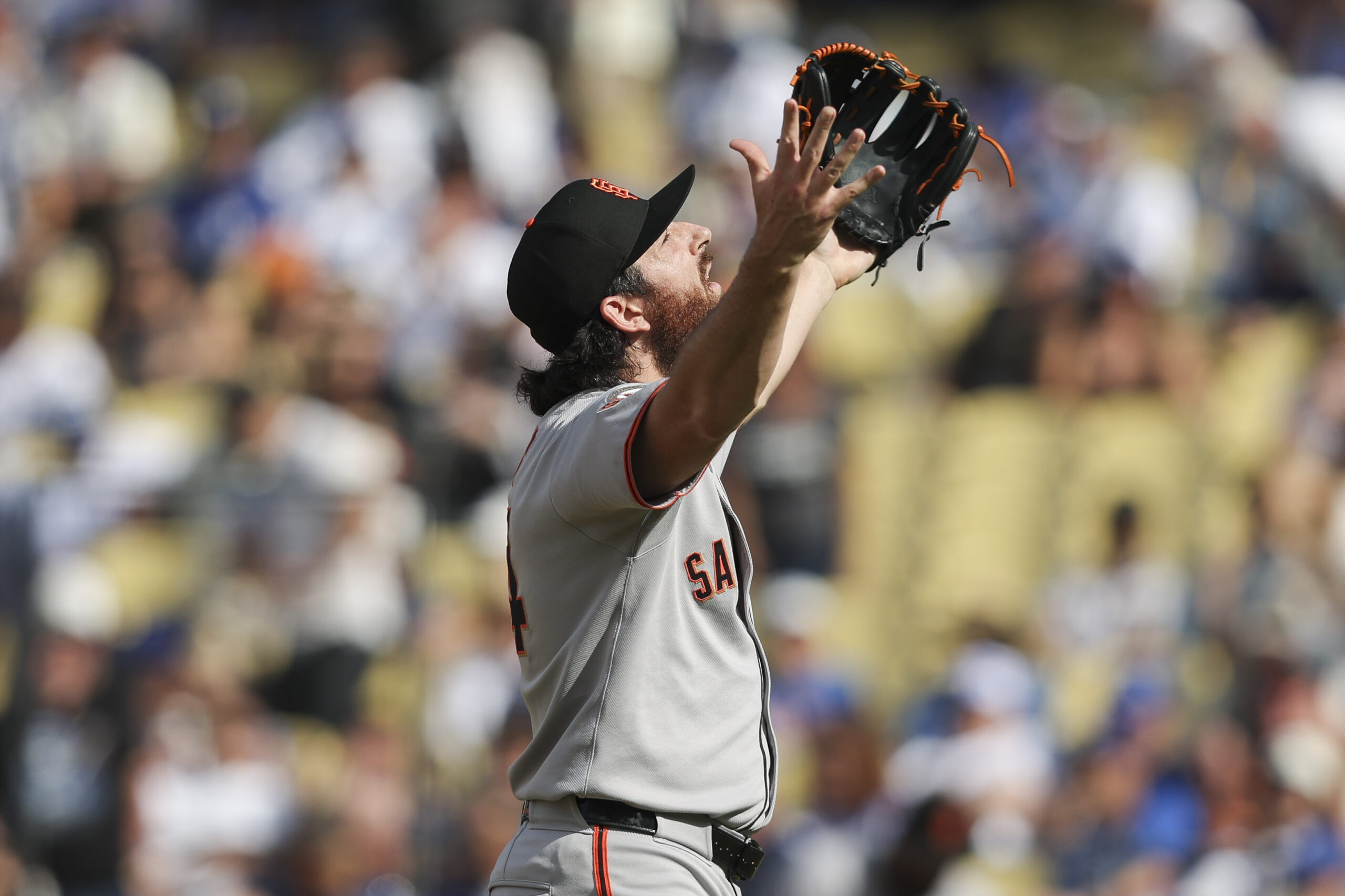 San Francisco Giants pitcher Ryan Walker reacts during the ninth...