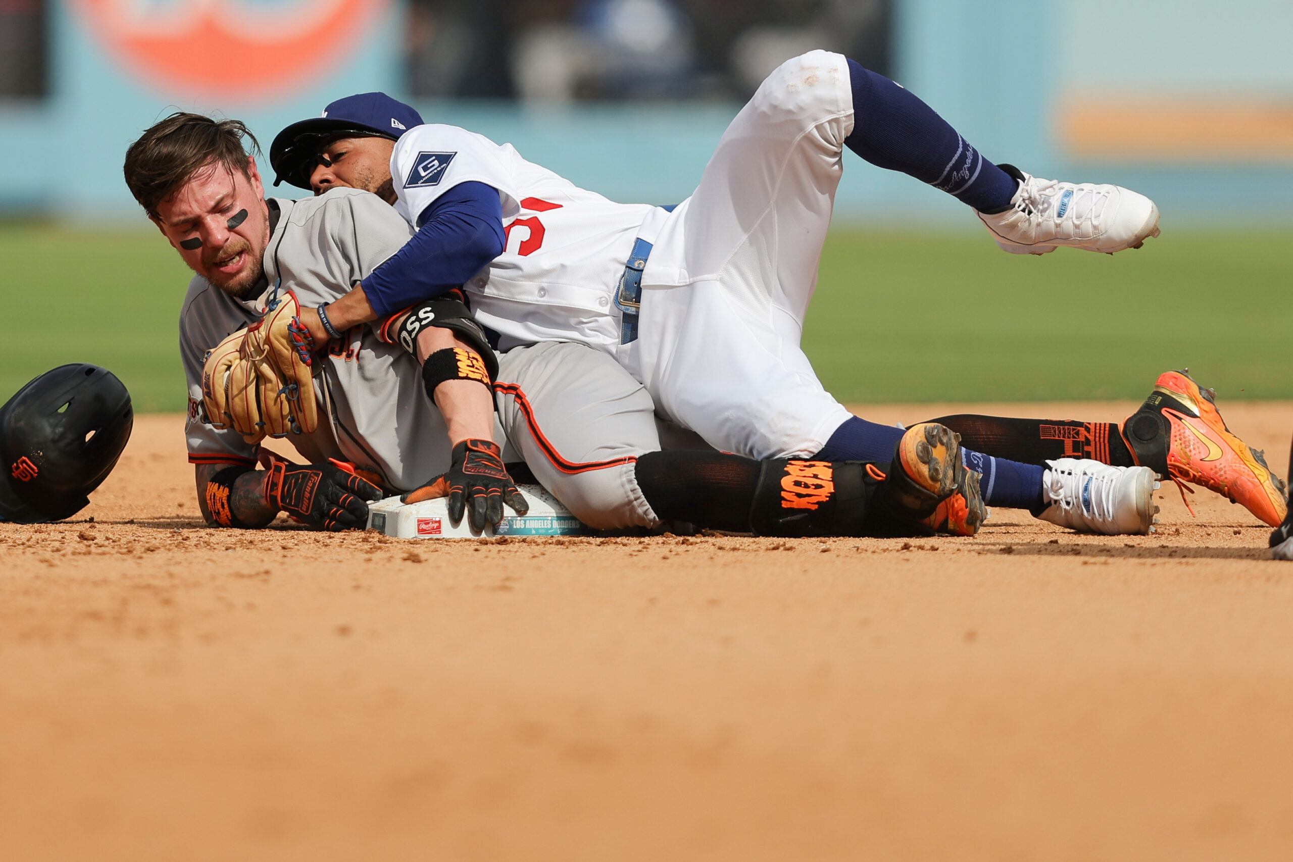 Los Angeles Dodgers shortstop Mookie Betts, right, attempts to tag...