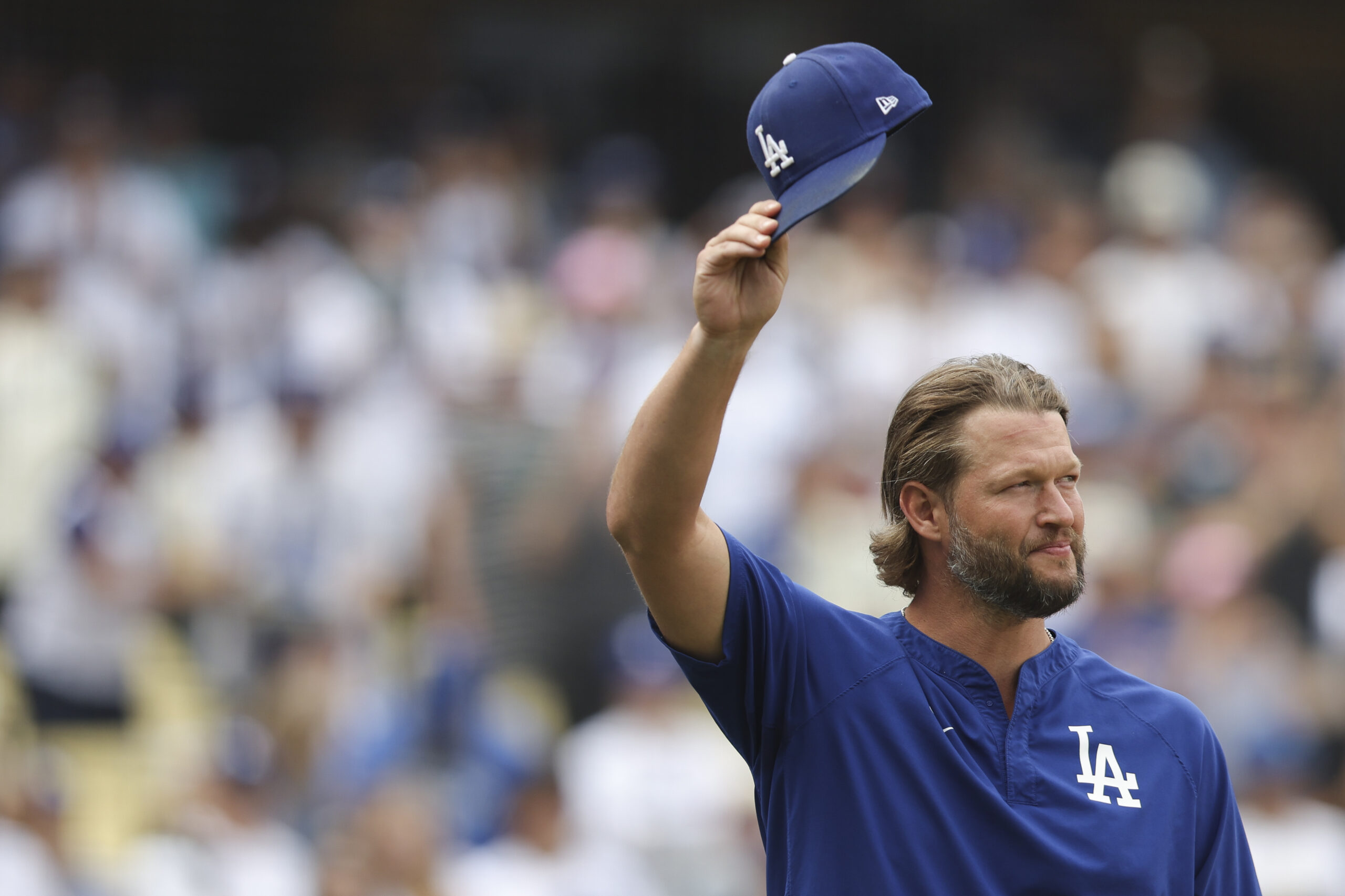 Los Angeles Dodgers pitcher Clayton Kershaw gestures before a baseball...