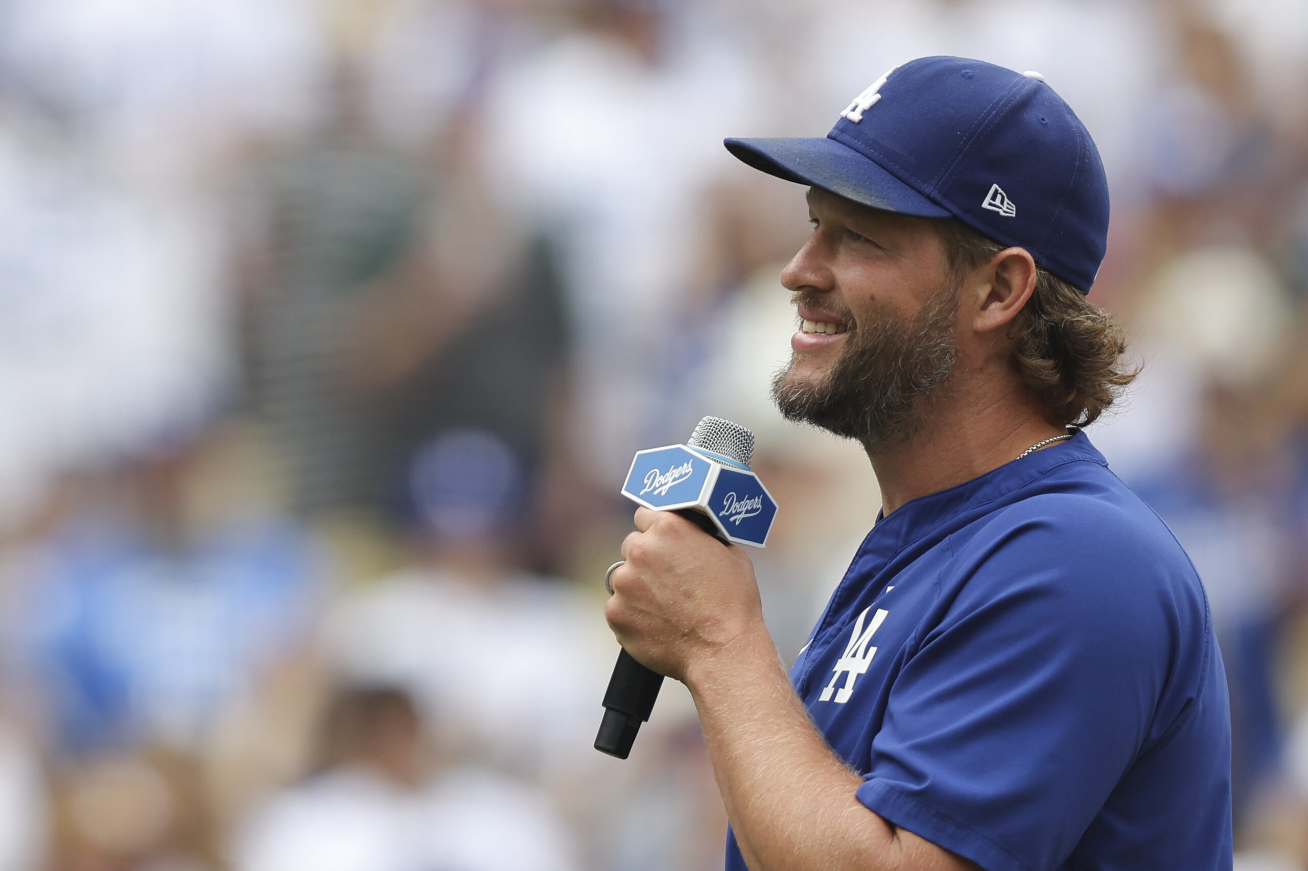Los Angeles Dodgers pitcher Clayton Kershaw speaks to fans before...