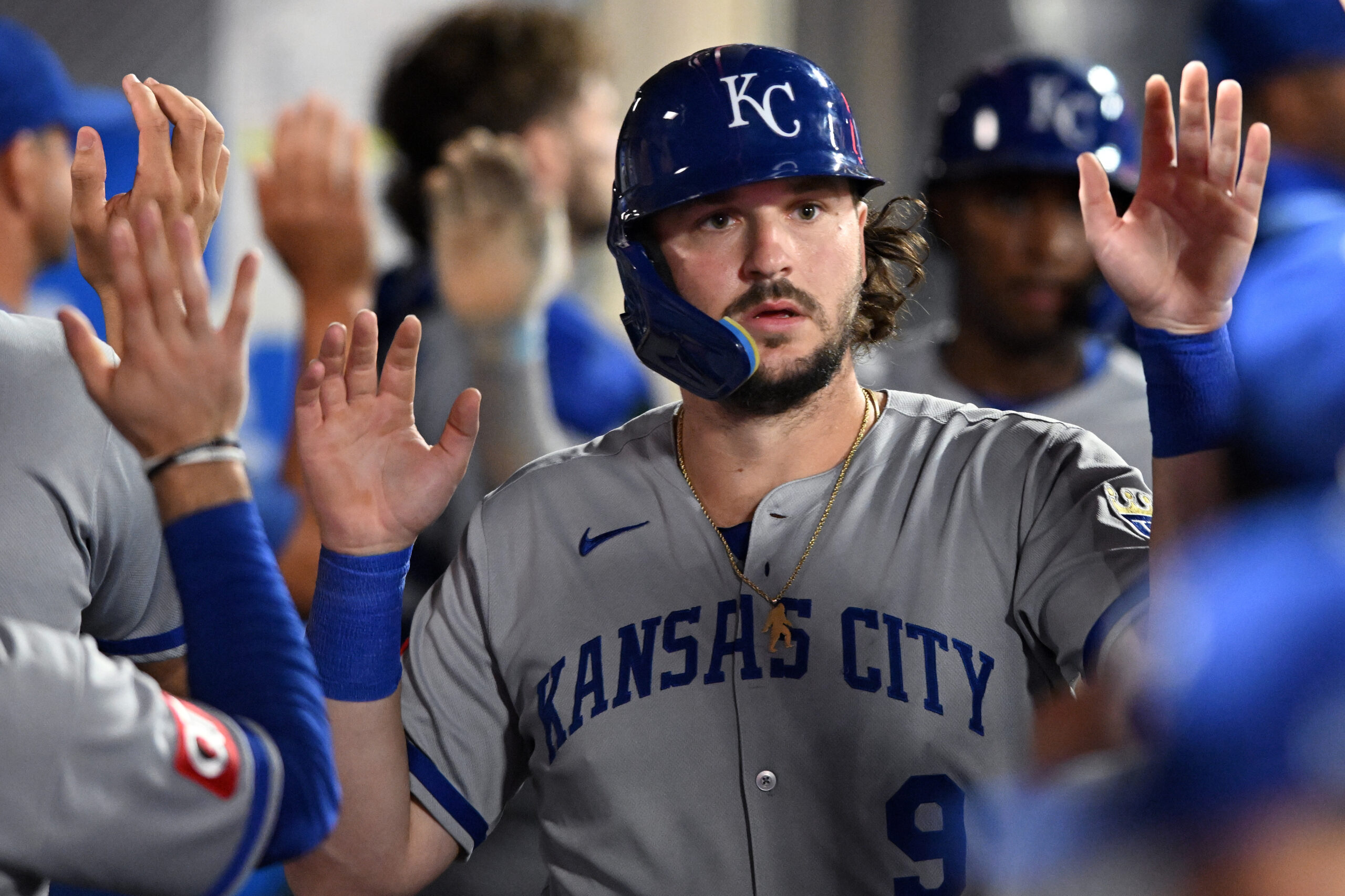 The Kansas City Royals’ Vinnie Pasquantino celebrates in the dugout...