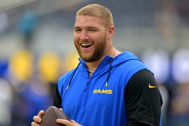 Aug 9, 2025; Inglewood, California, USA; Los Angeles Rams defensive end Braden Fiske (55) throws around a football on the field prior to the game against the Dallas Cowboys at SoFi Stadium. Mandatory Credit: Jayne Kamin-Oncea-Imagn Images Braden Fiske, Rams