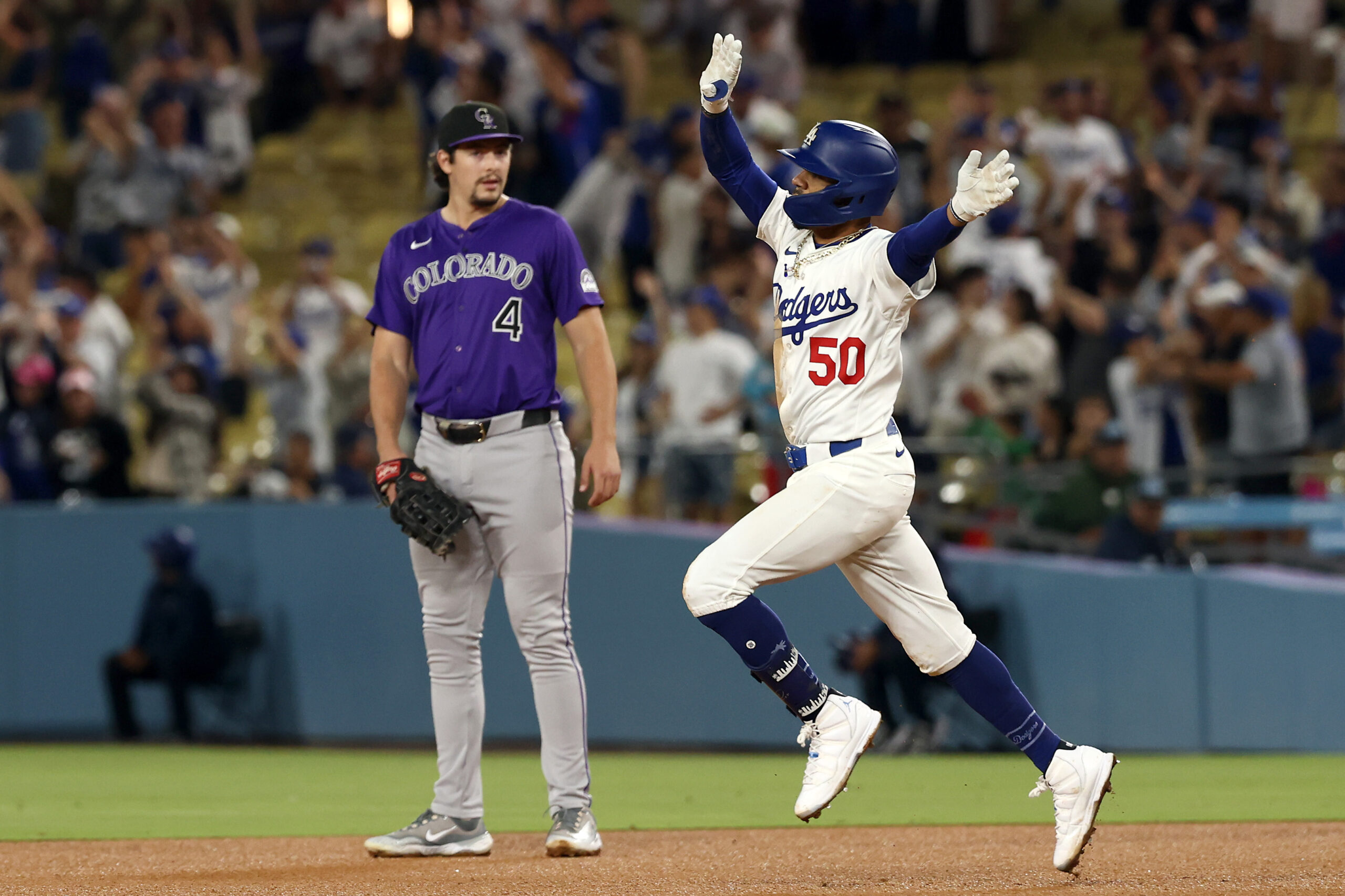 The Dodgers’ Mookie Betts celebrates as he runs the bases...