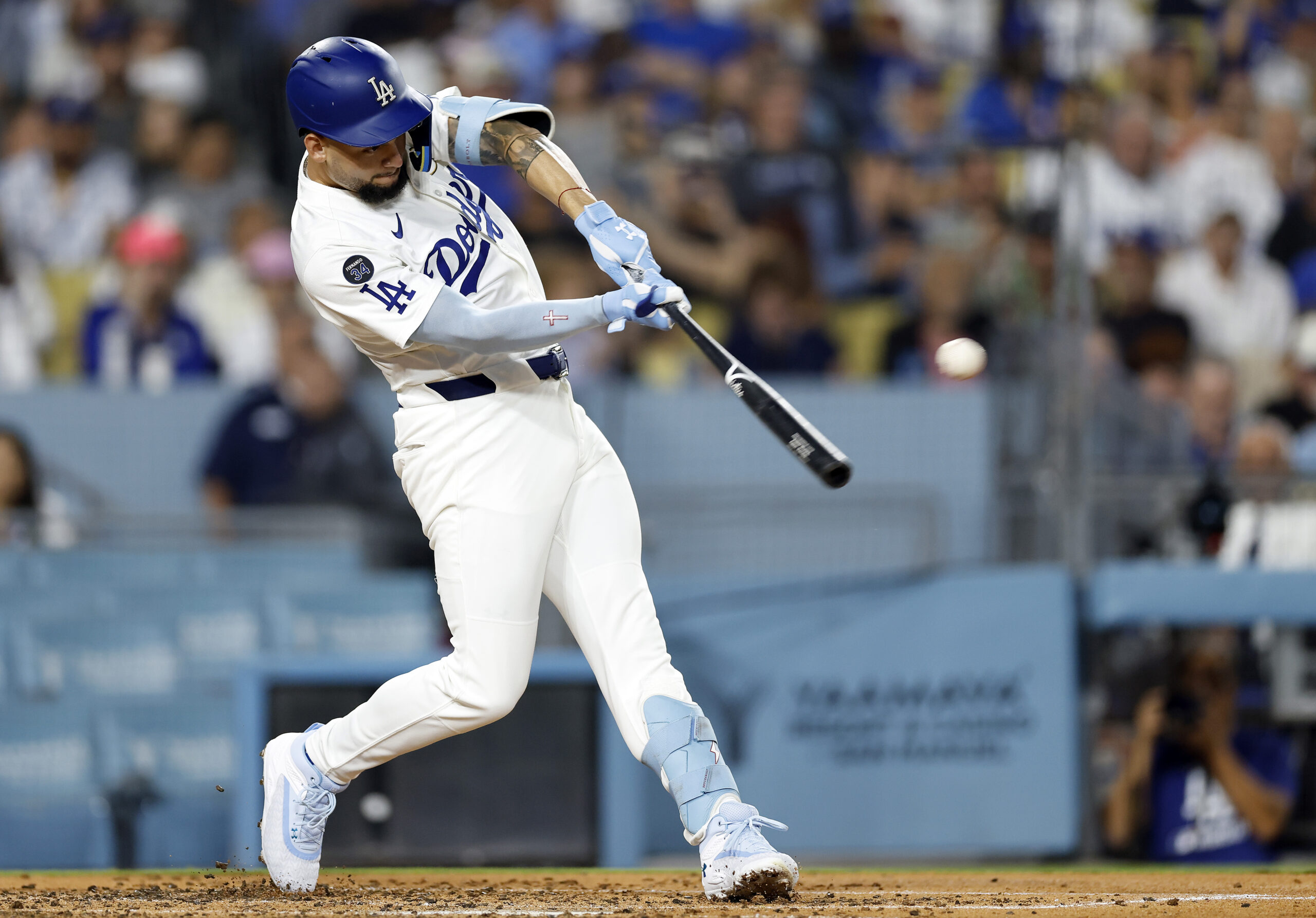 The Dodgers’ Andy Pages hits a double during the third...
