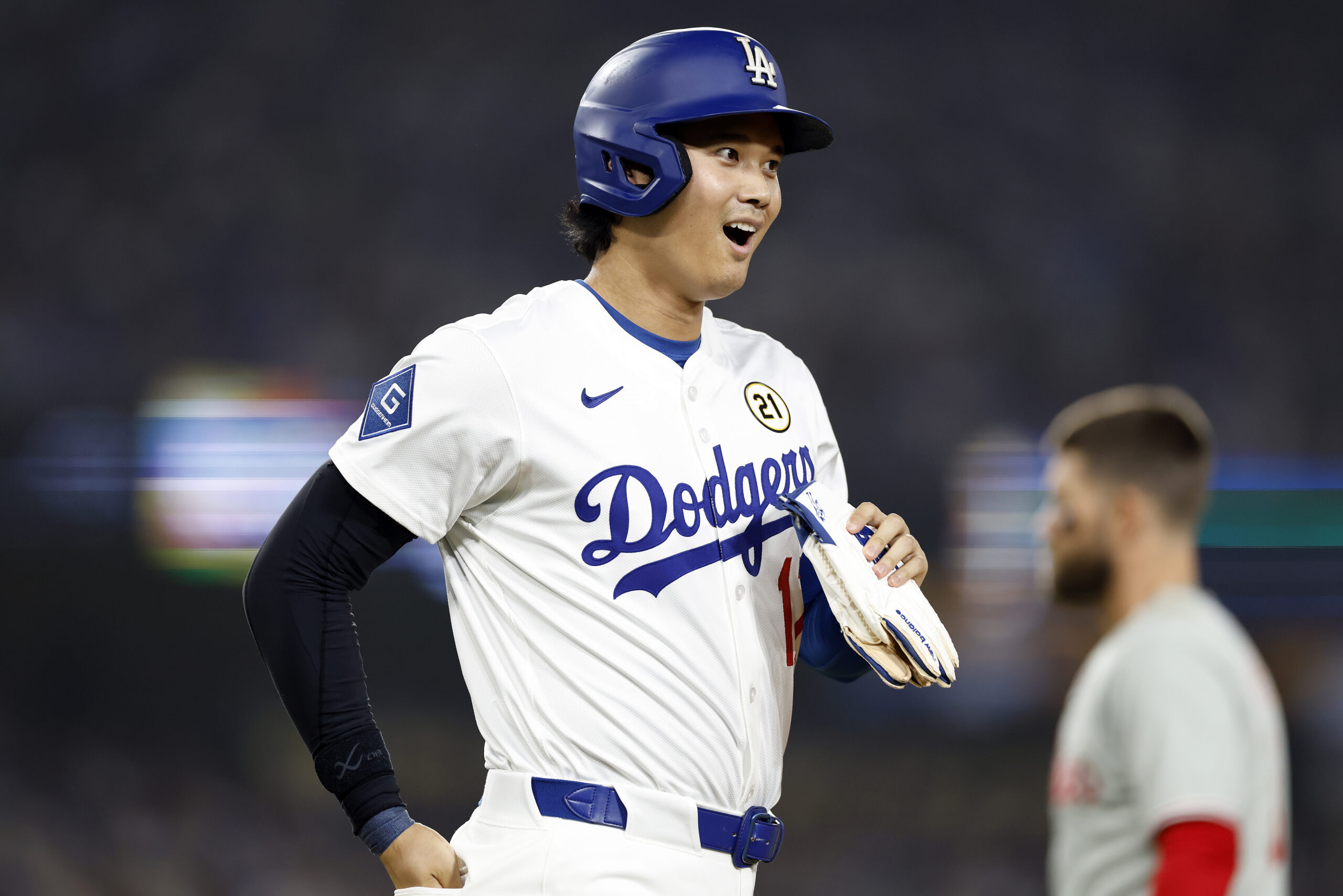 Dodgers star Shohei Ohtani walks to first base during the...