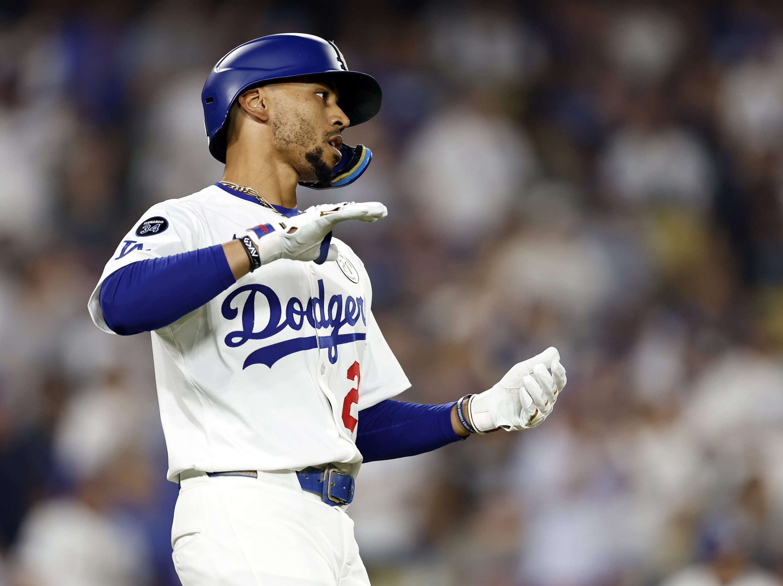 The Dodgers’ Mookie Betts celebrates after hitting a sacrifice fly...