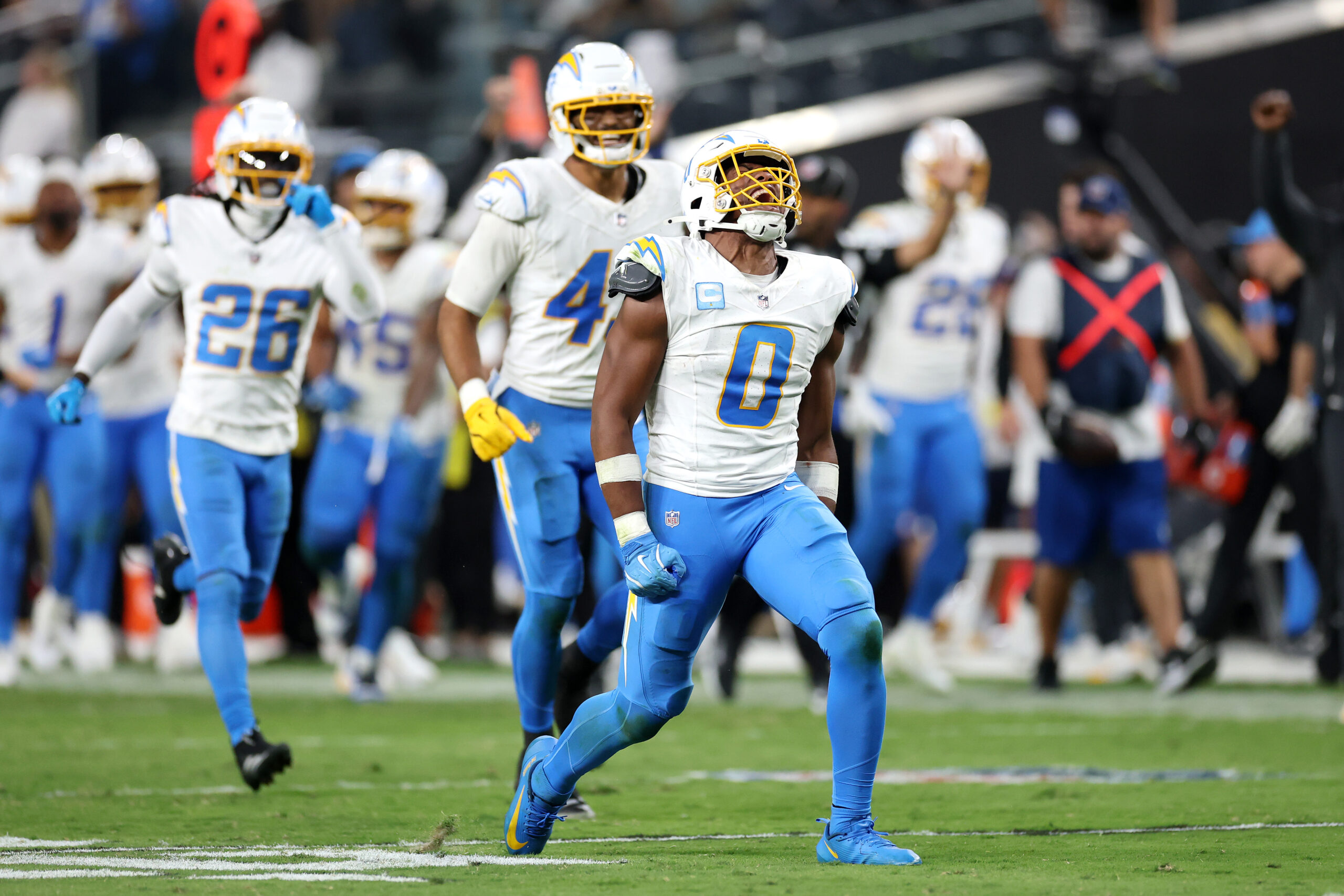 Chargers linebacker Daiyan Henley (0) celebrates a play during the...