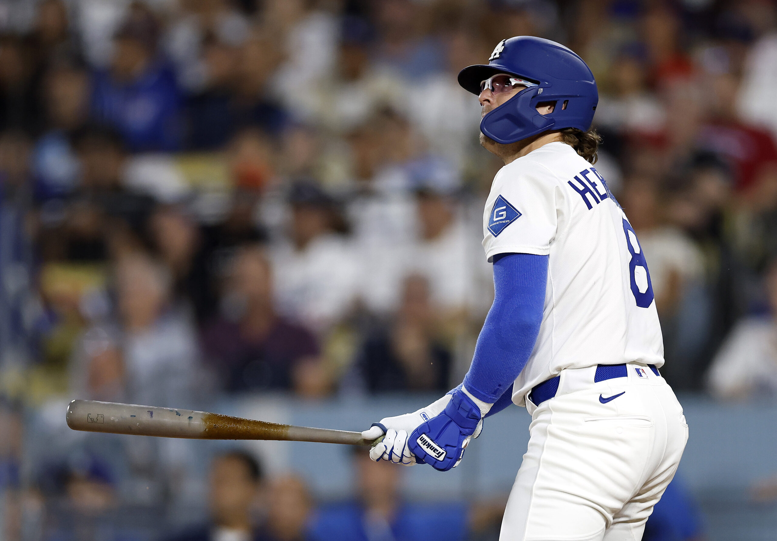 The Dodgers’ Kiké Hernandez watches the flight of his two-run...