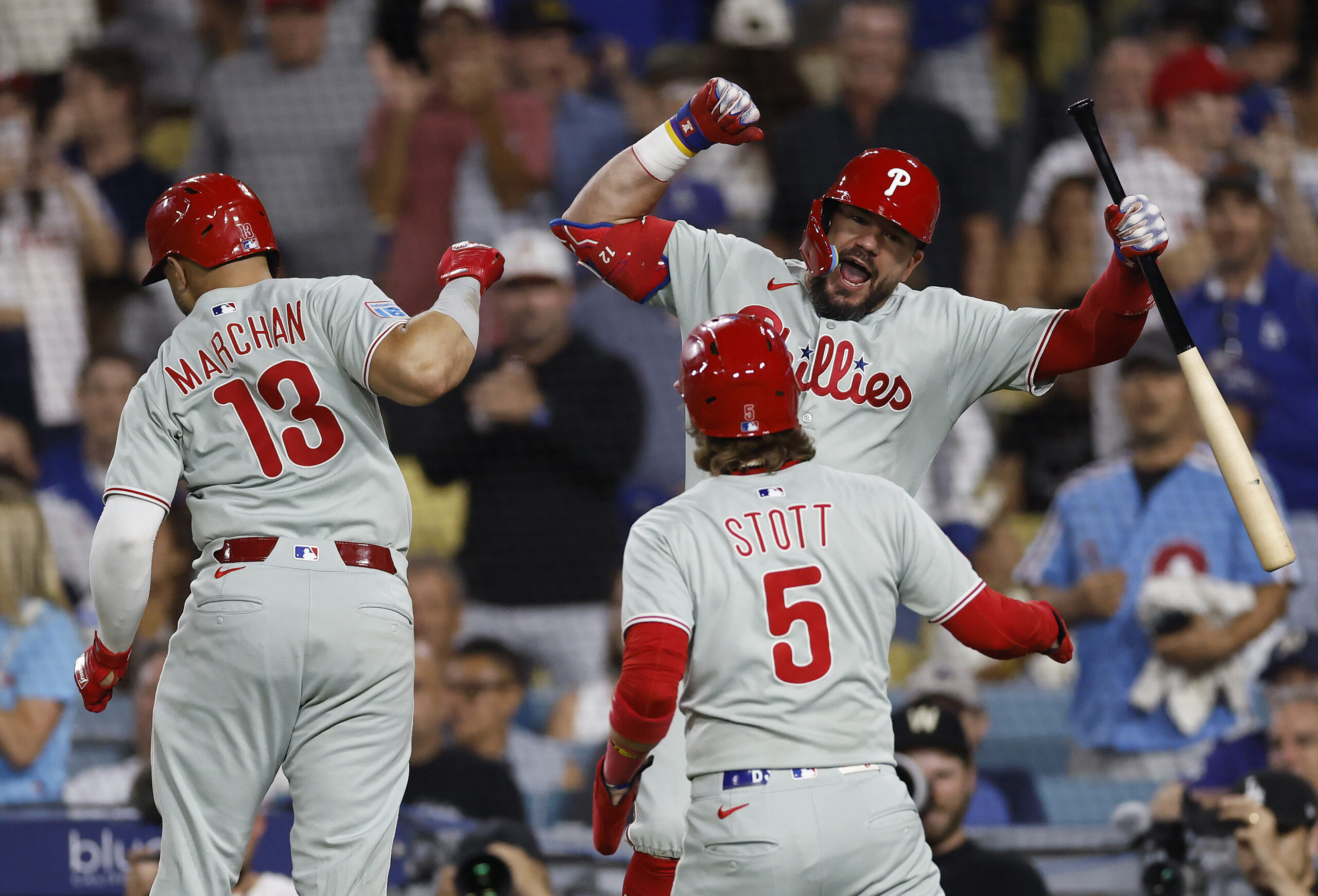 The Philadelphia Phillies’ Rafael Marchán (13) celebrates with teammate Kyle...