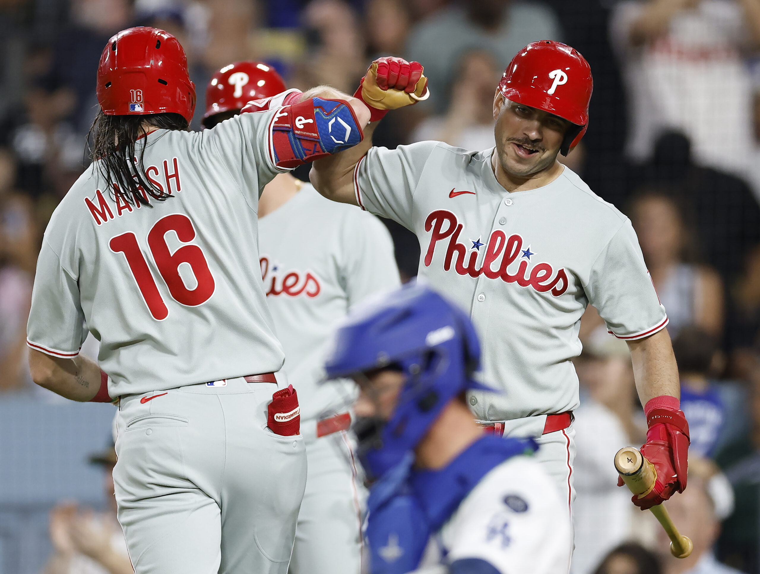 The Philadelphia Phillies’ Brandon Marsh, left, celebrates with teammate Otto...