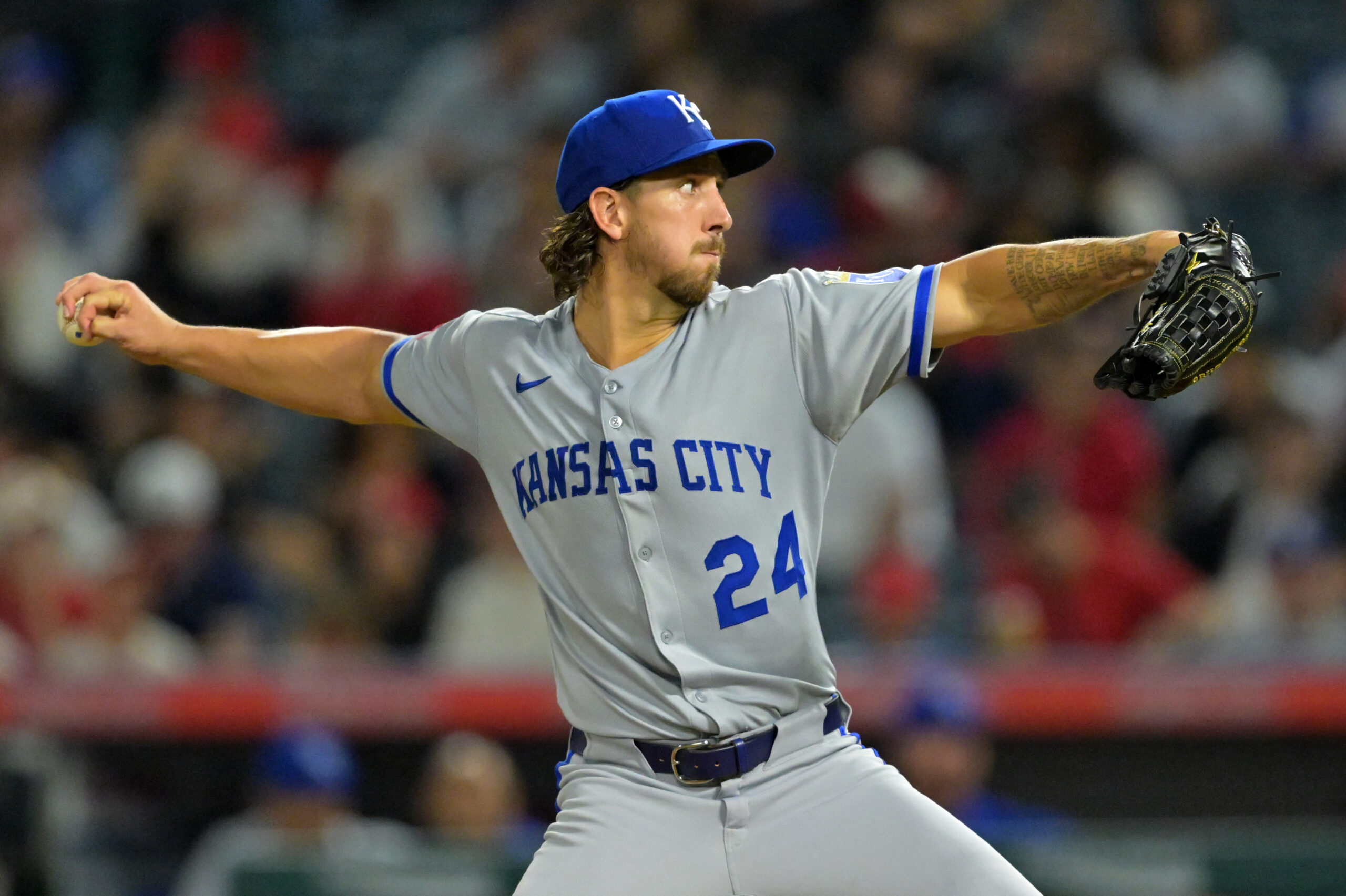 Kansas City Royals starting pitcher Michael Lorenzen throws to the...