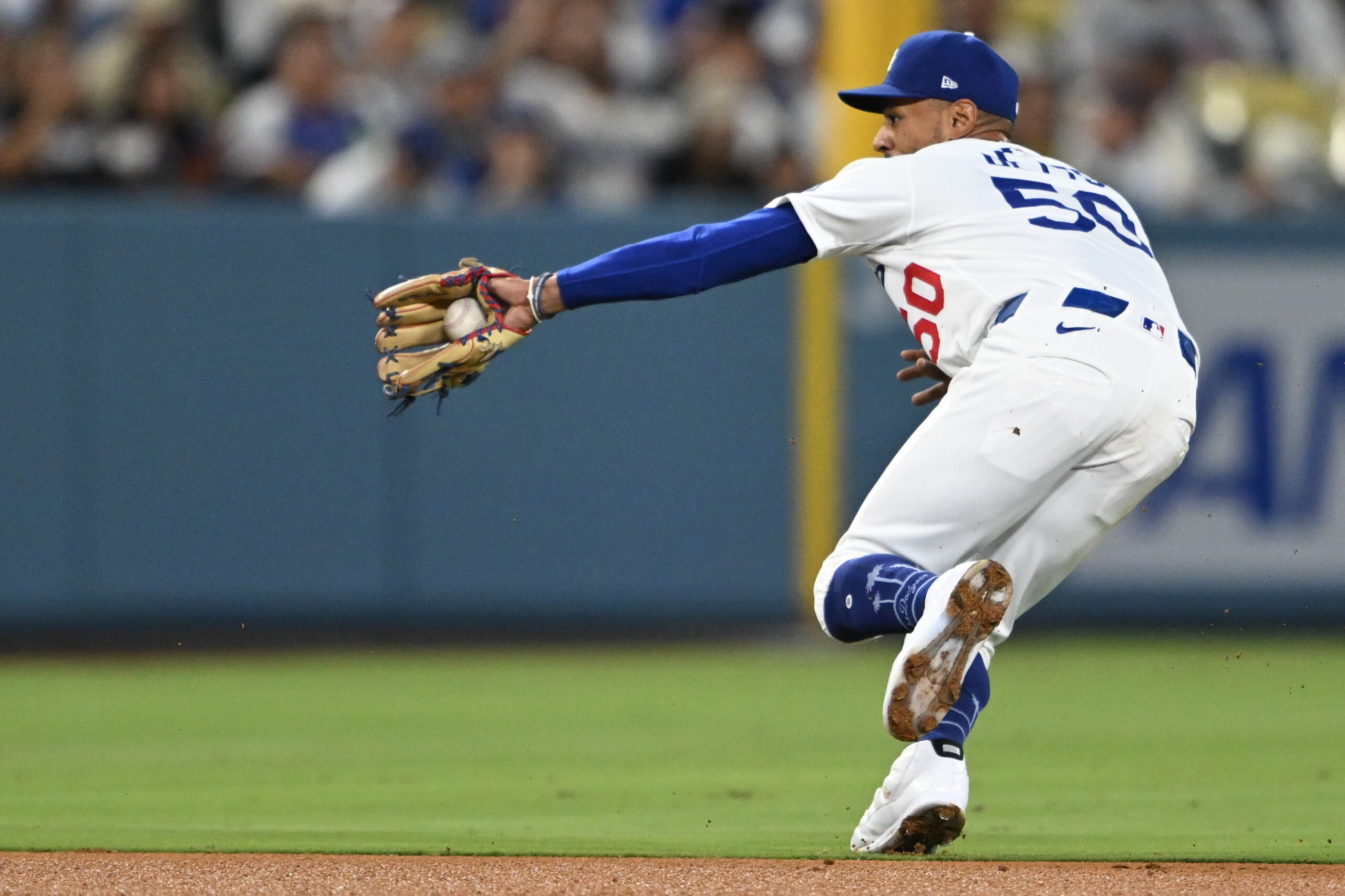 Dodgers shortstop Mookie Betts catches a line drive hit by...