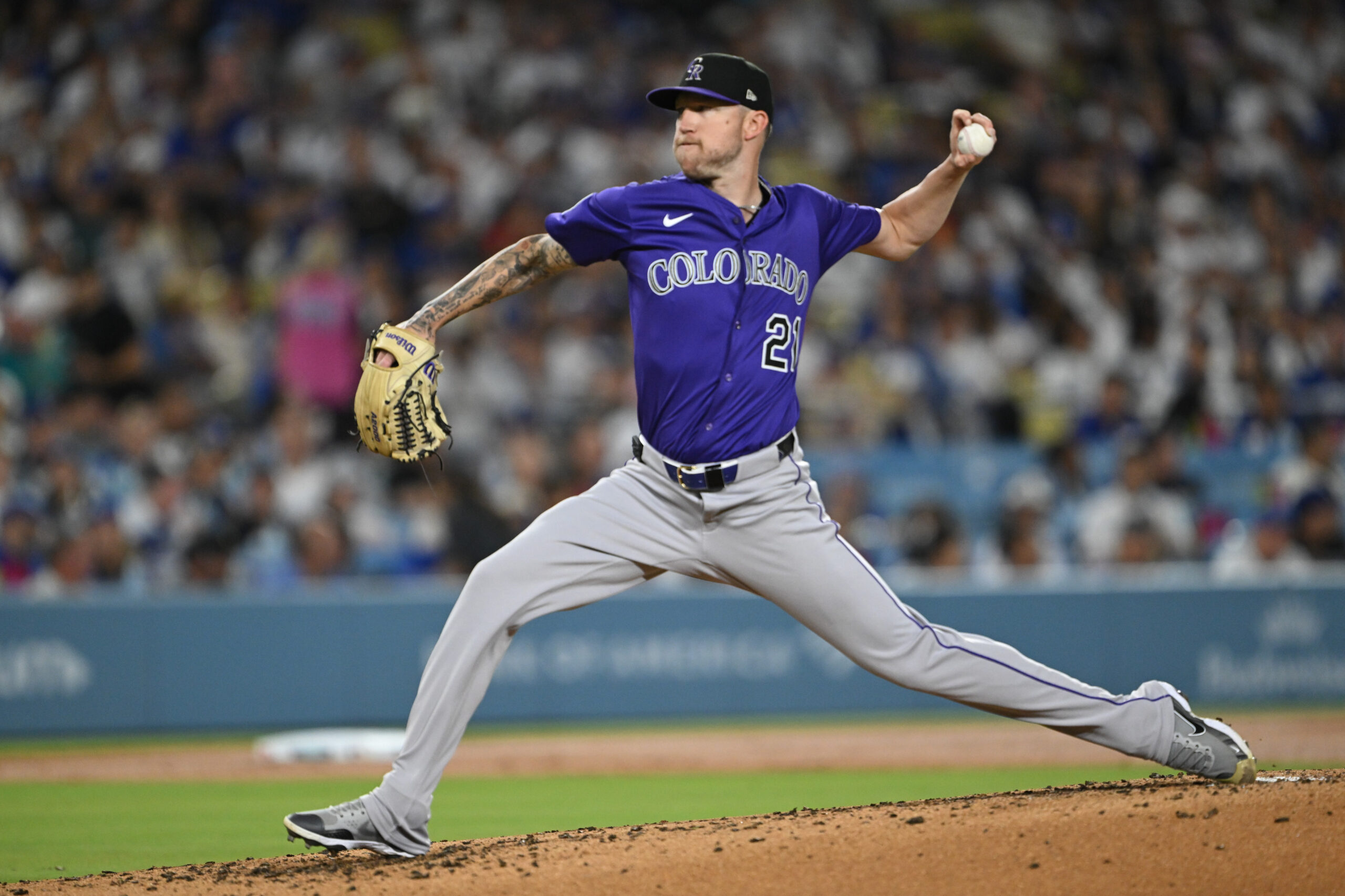 Colorado Rockies starting pitcher Kyle Freeland throws to the plate...