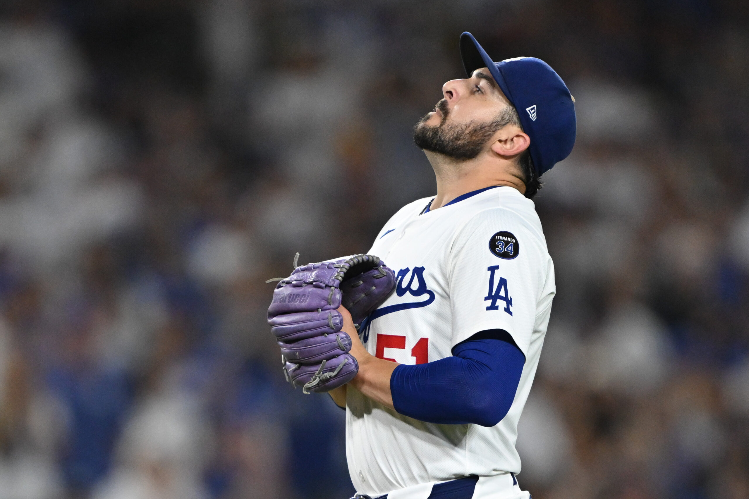 Dodgers relief pitcher Alex Vesia catches his breath as he...