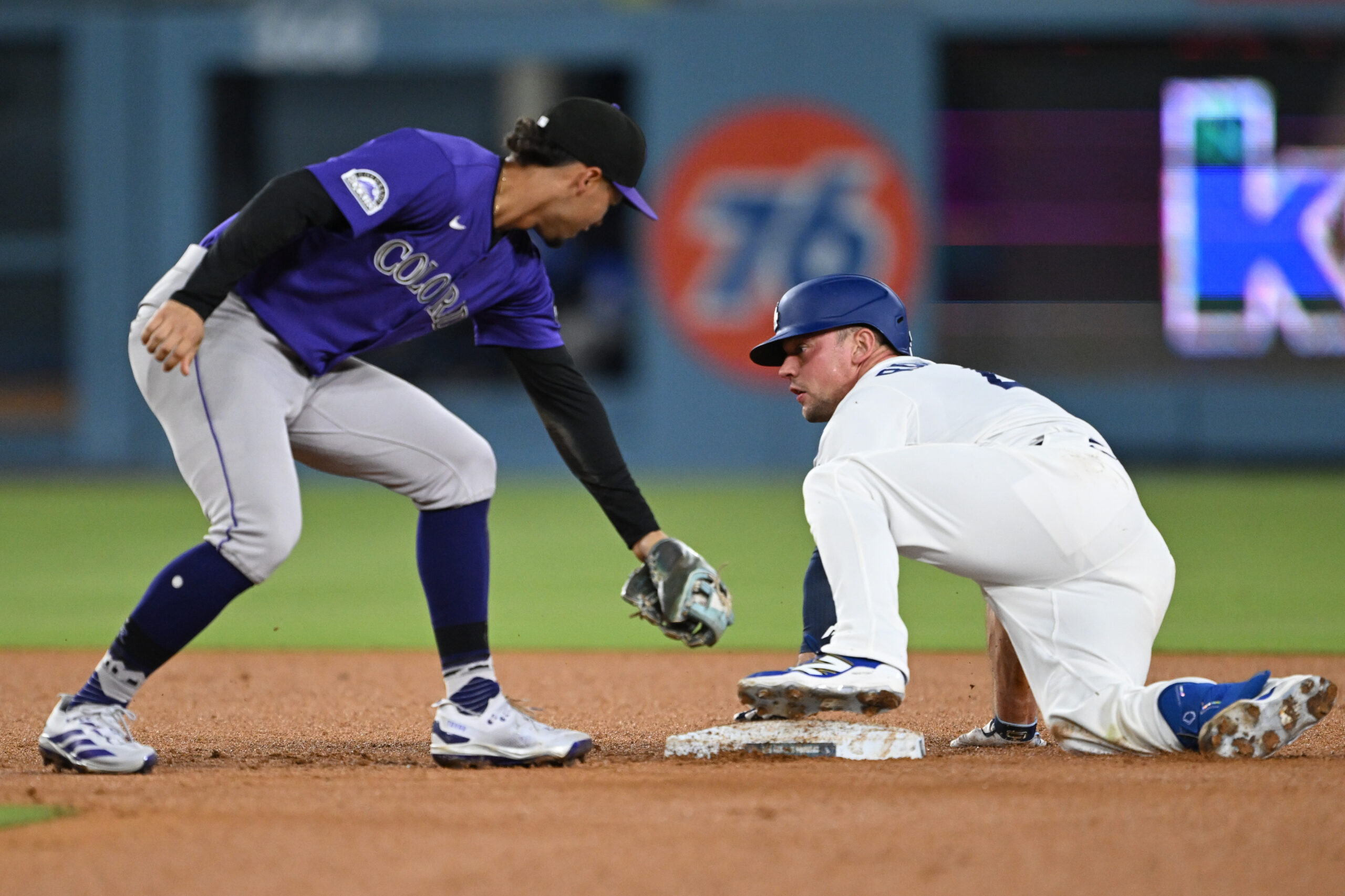 The Dodgers’ Ben Rortvedt, right, is safe at second base...