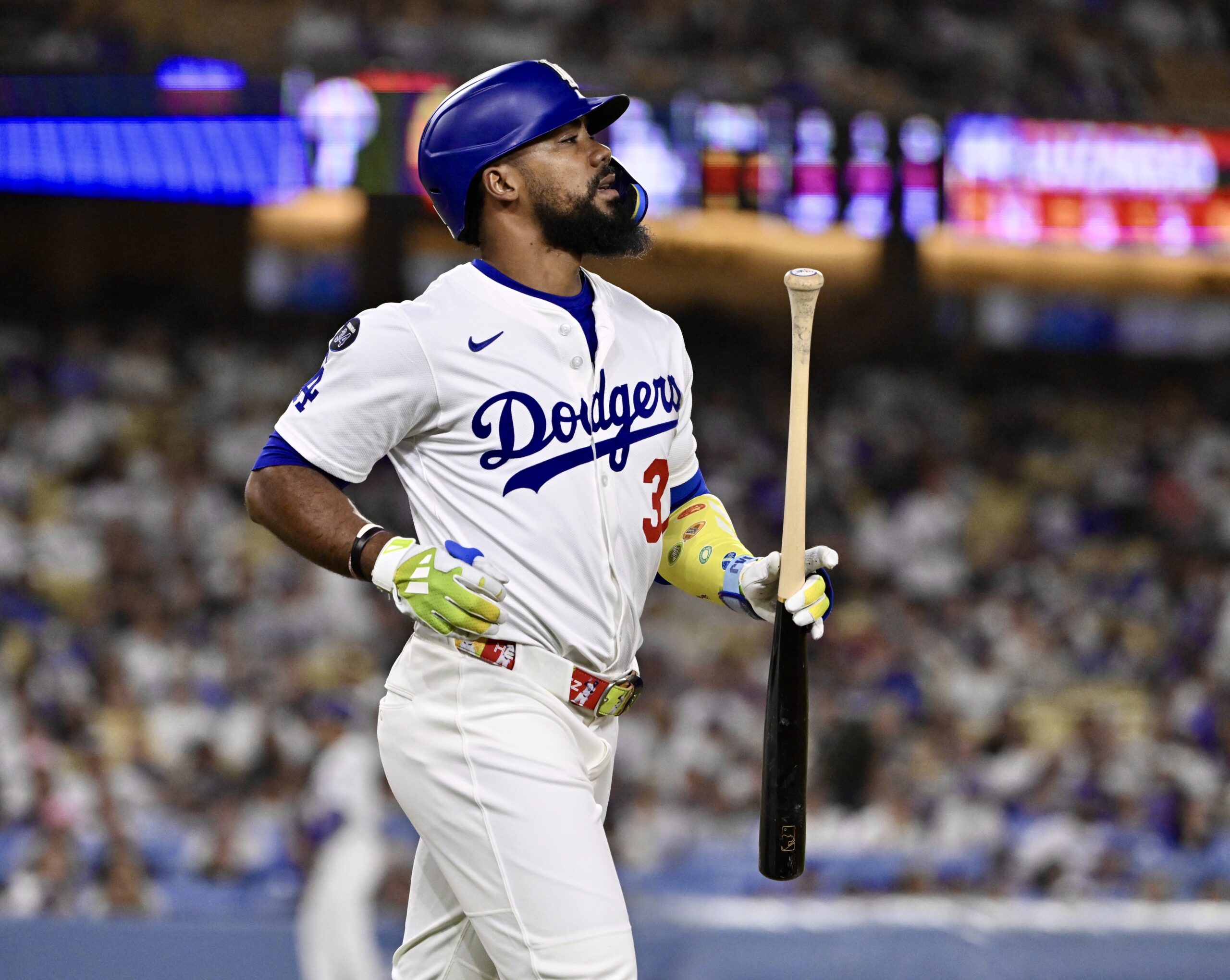 The Dodgers’ Teoscar Hernández jogs up the first-base line as...
