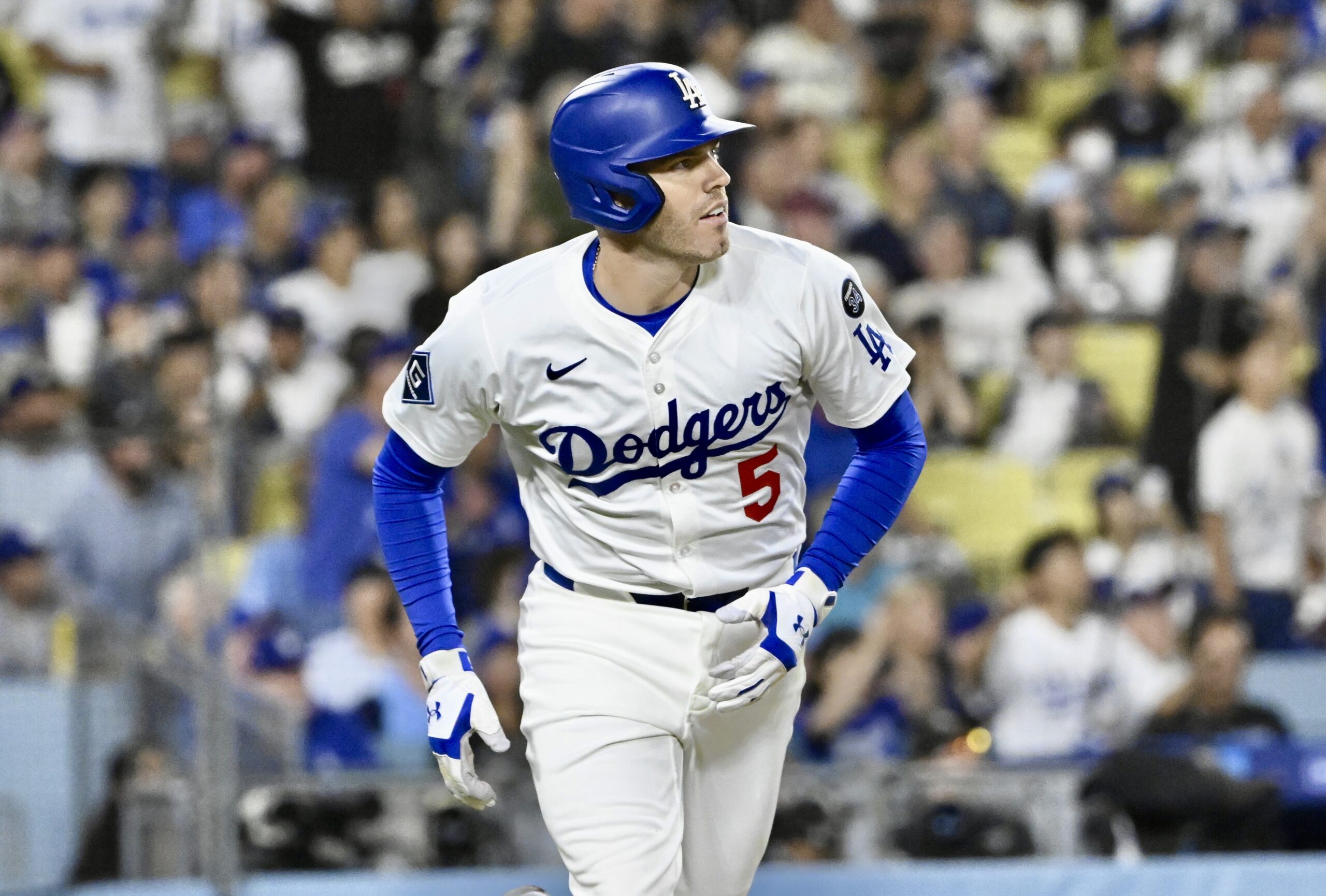 The Dodgers’ Freddie Freeman begins to run the bases as...
