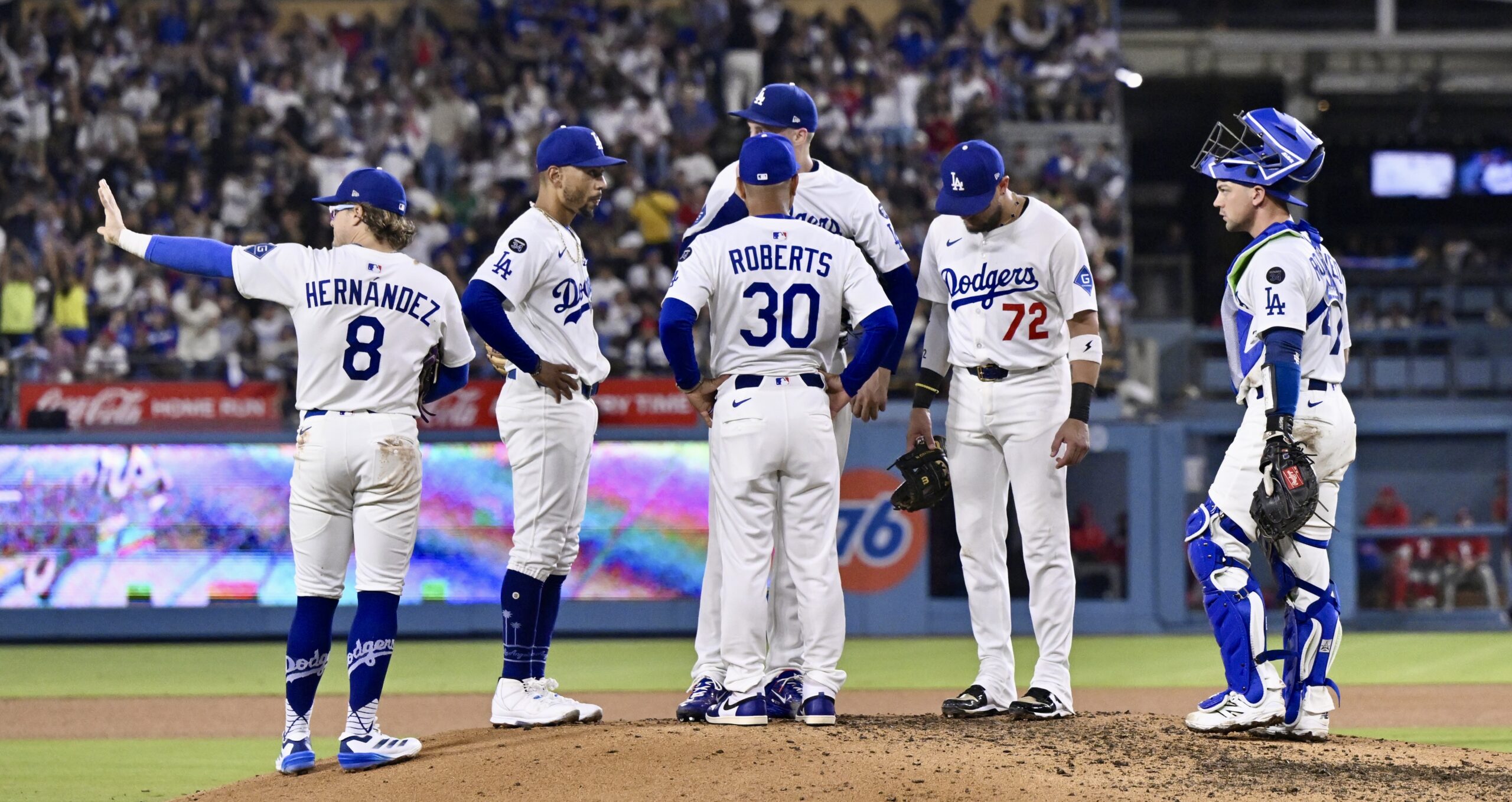 Dodgers manager Dave Roberts (30) decides to let starting pitcher...