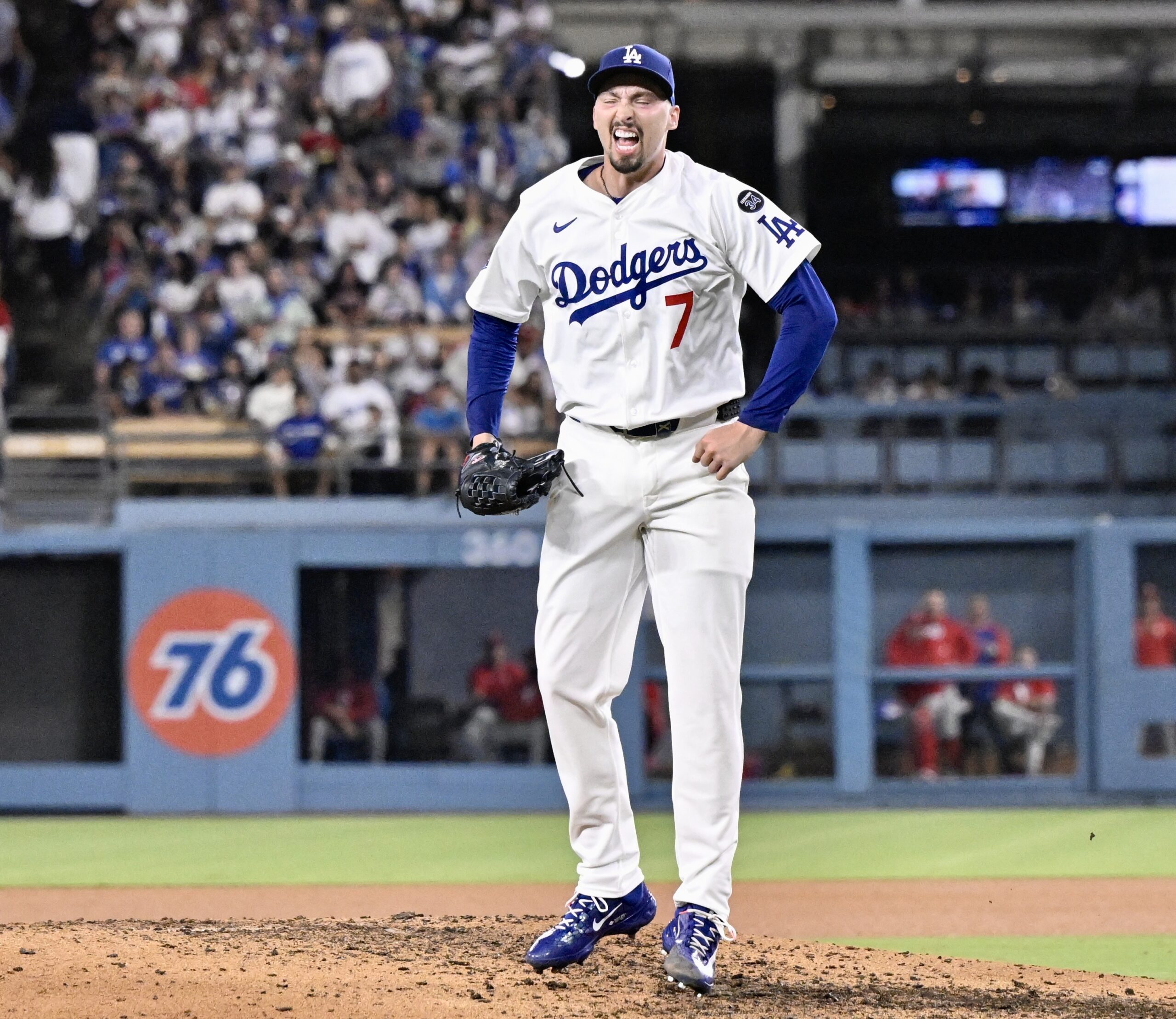 Dodgers starting pitcher Blake Snell celebrates after striking out the...