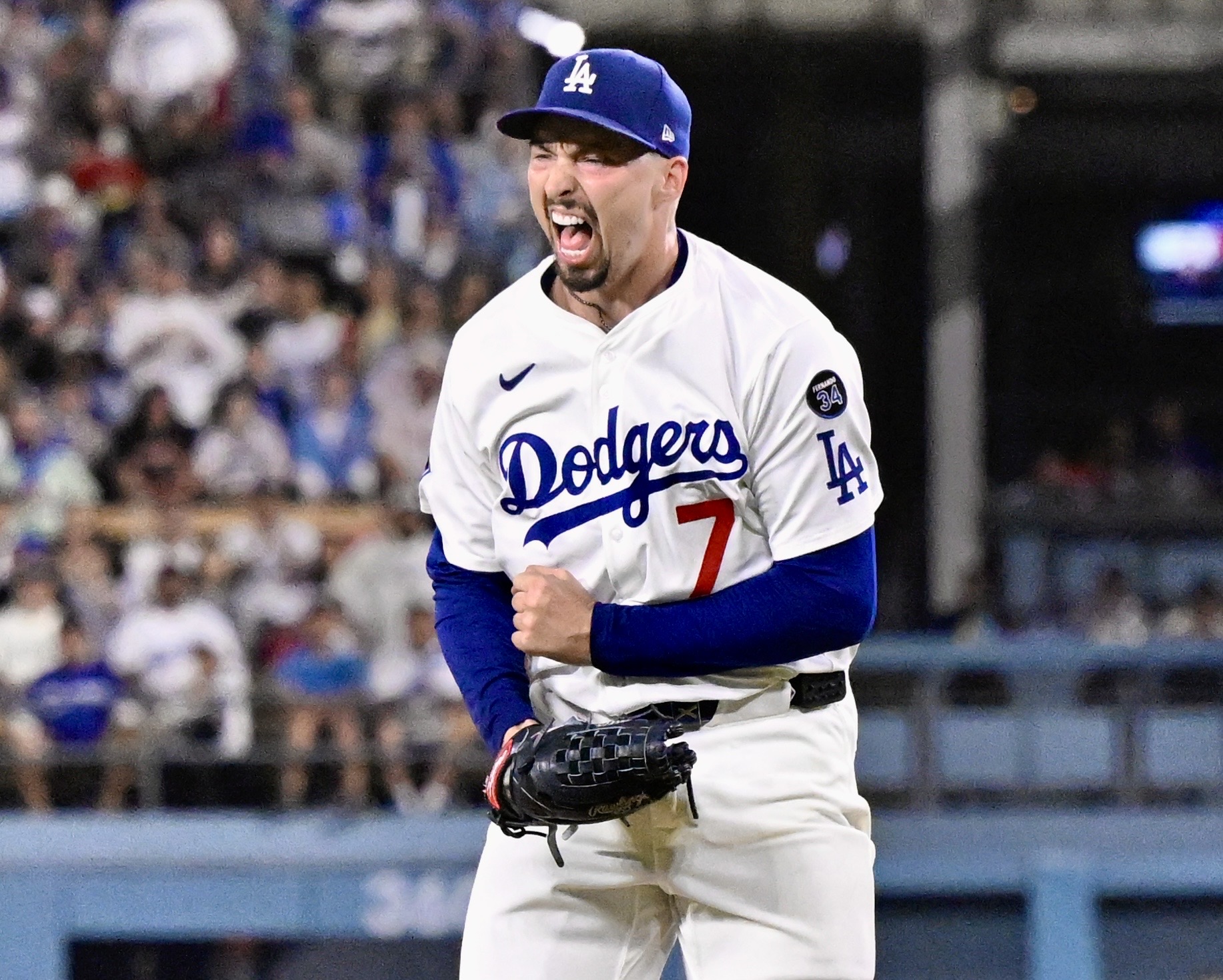 Dodgers starting pitcher Blake Snell celebrates after striking out the...