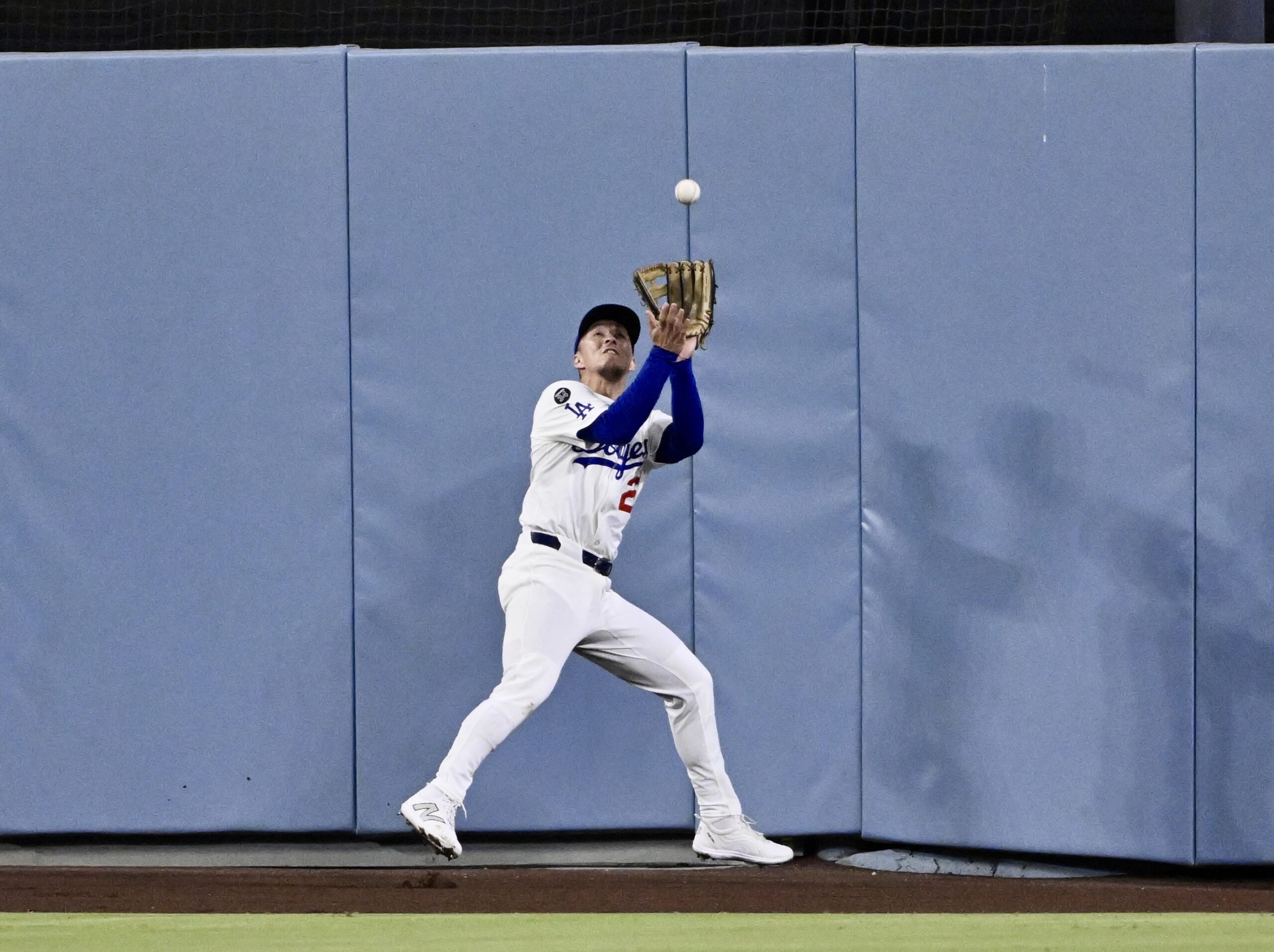Dodgers center fielder Tommy Edman makes a catch on a...