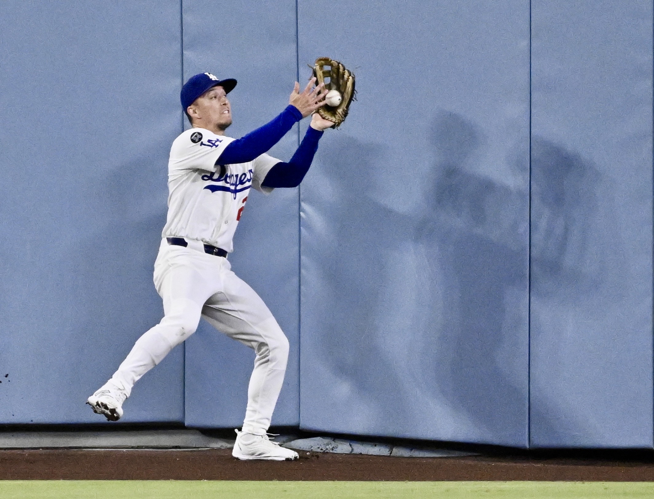Dodgers center fielder Tommy Edman makes a catch on a...