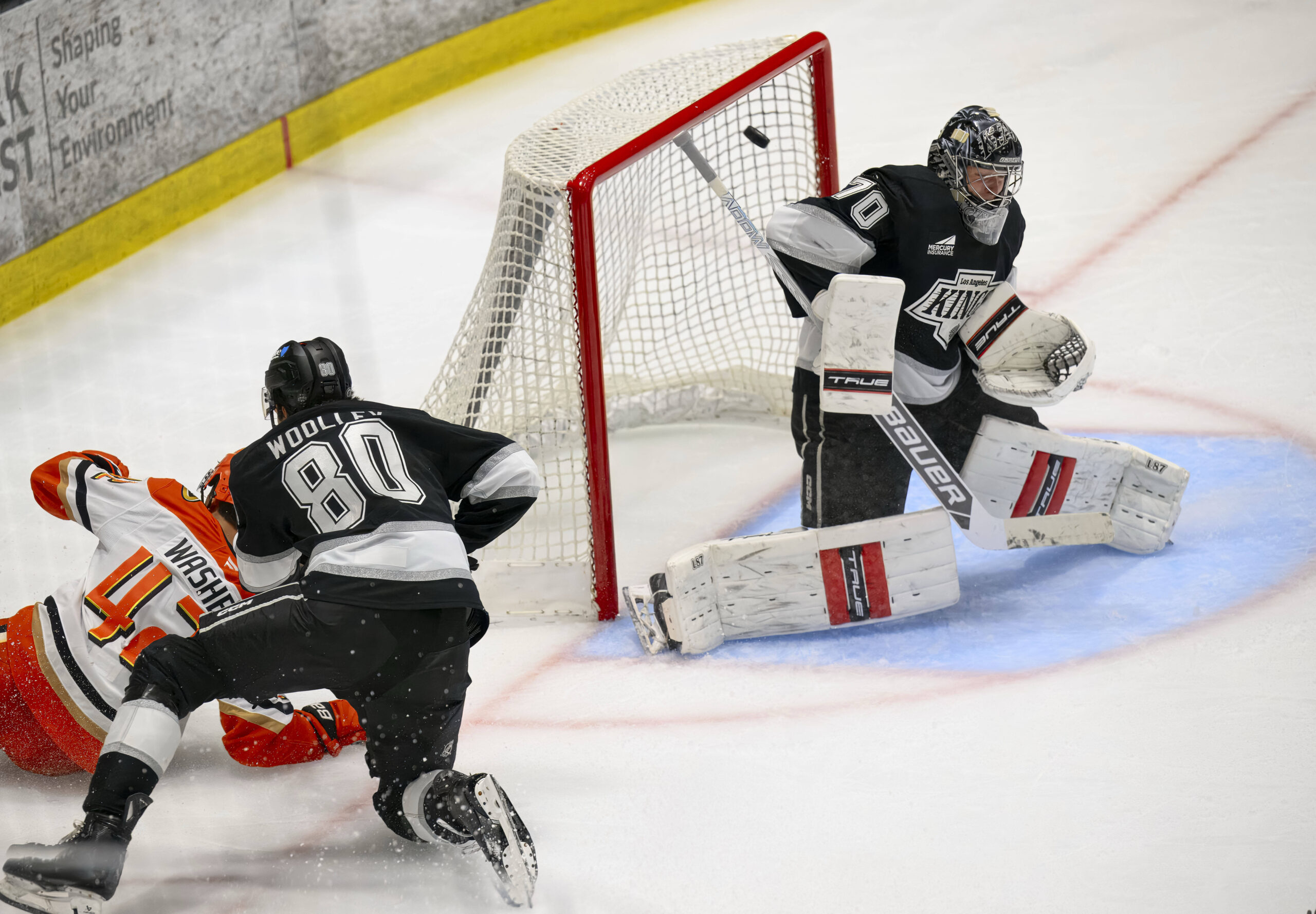 Goalie Carter George deflects a shot over the goal by...