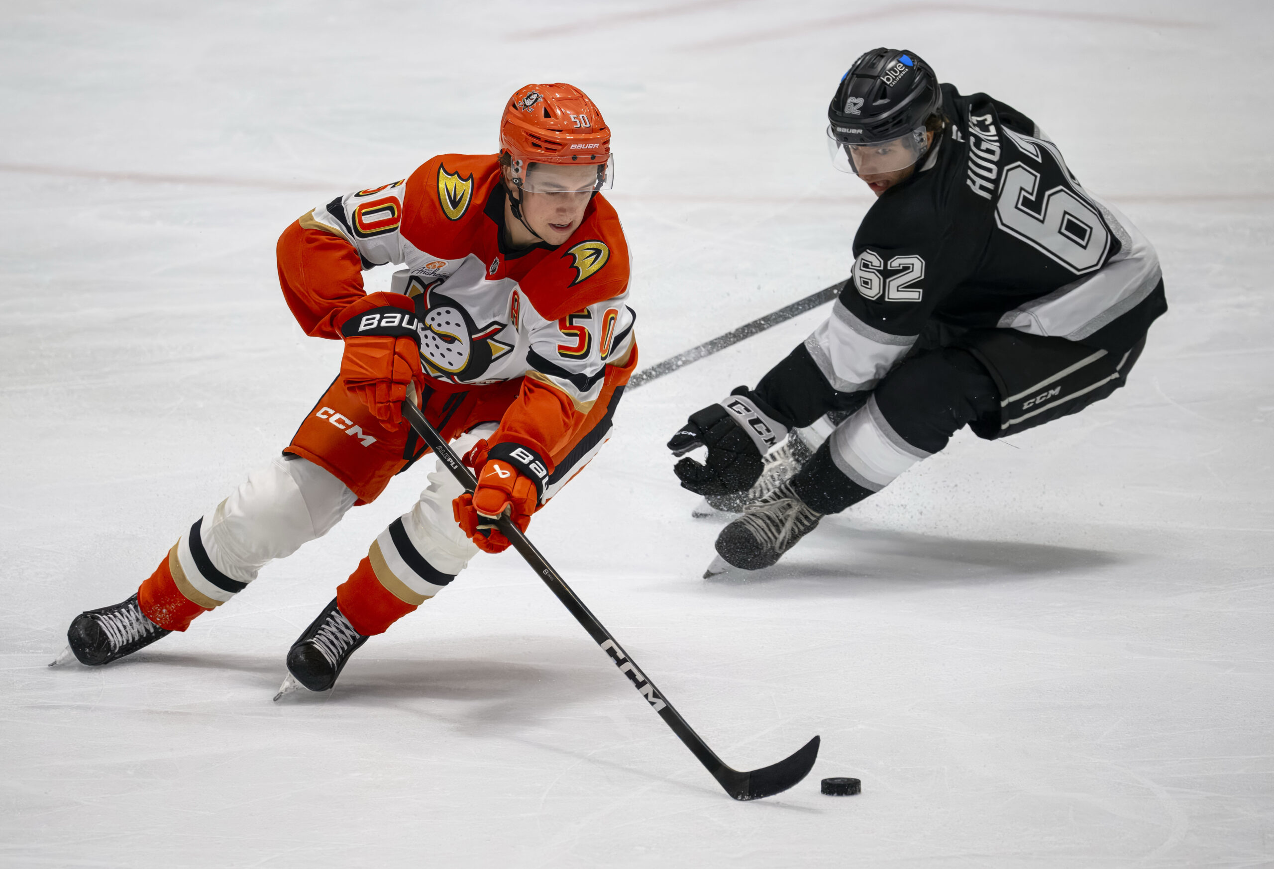 The Duck’s Stian Solberg, left, skates around the Kings’ Jack...