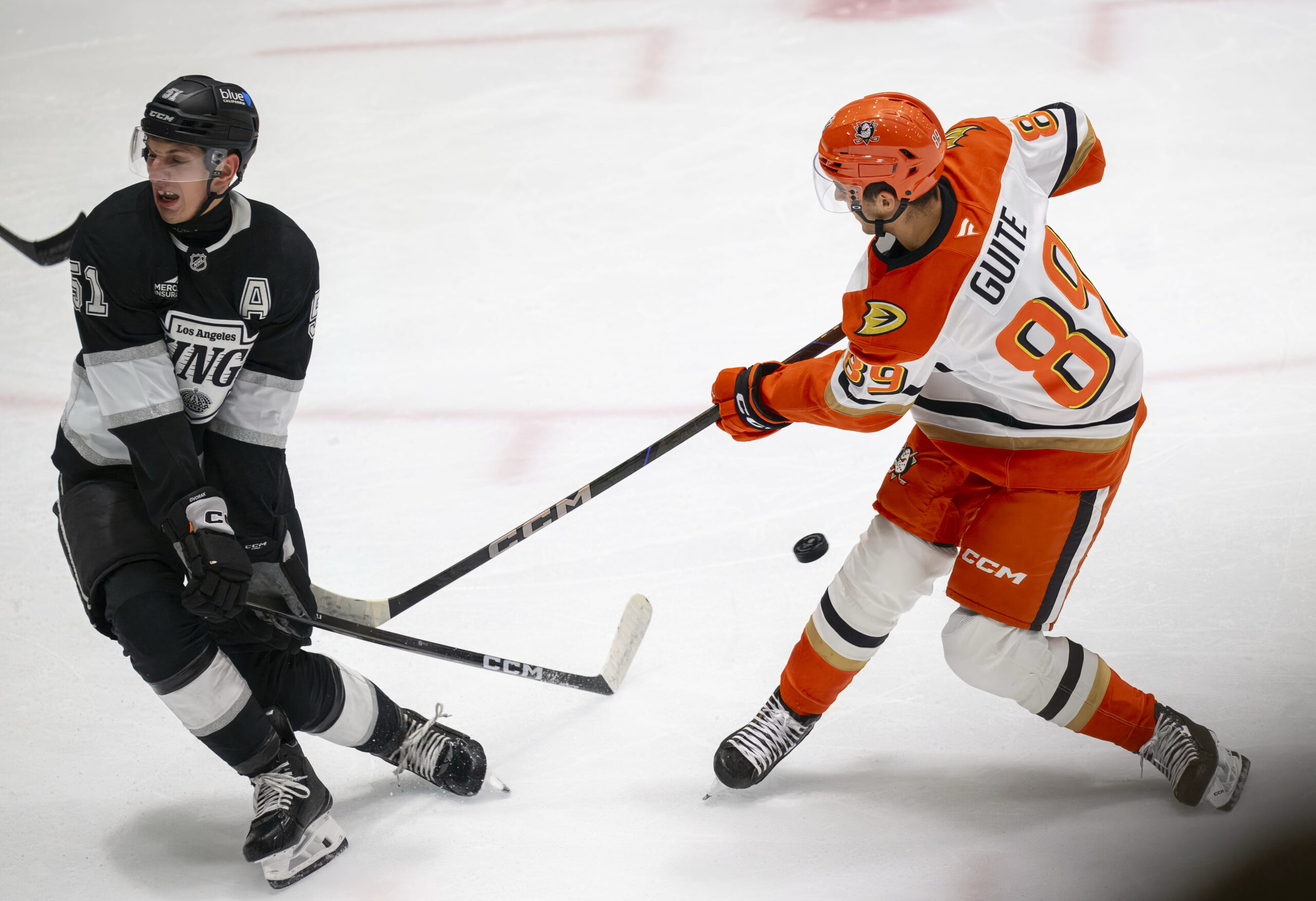 The Kings’ Jakub Dvorak, left, deflects a shot by the...