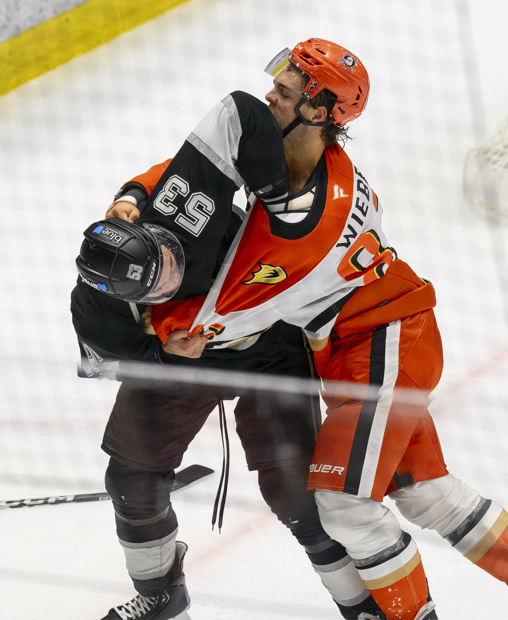 The Ducks’ Jaxsen Wiebe, right, and the Kings’ Jared Wright...