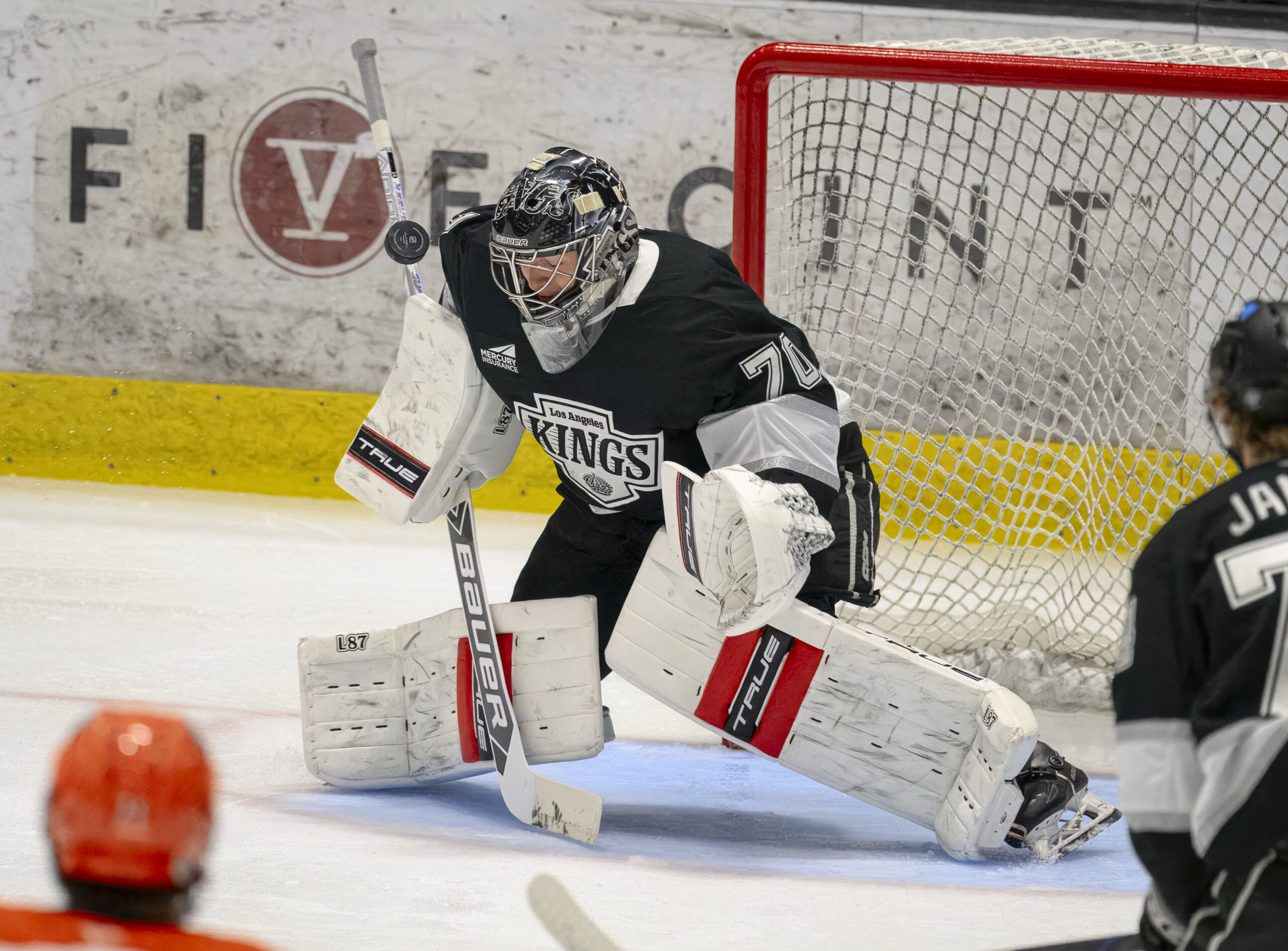 The Kings’ goalie Carter George blocks a shot by the...